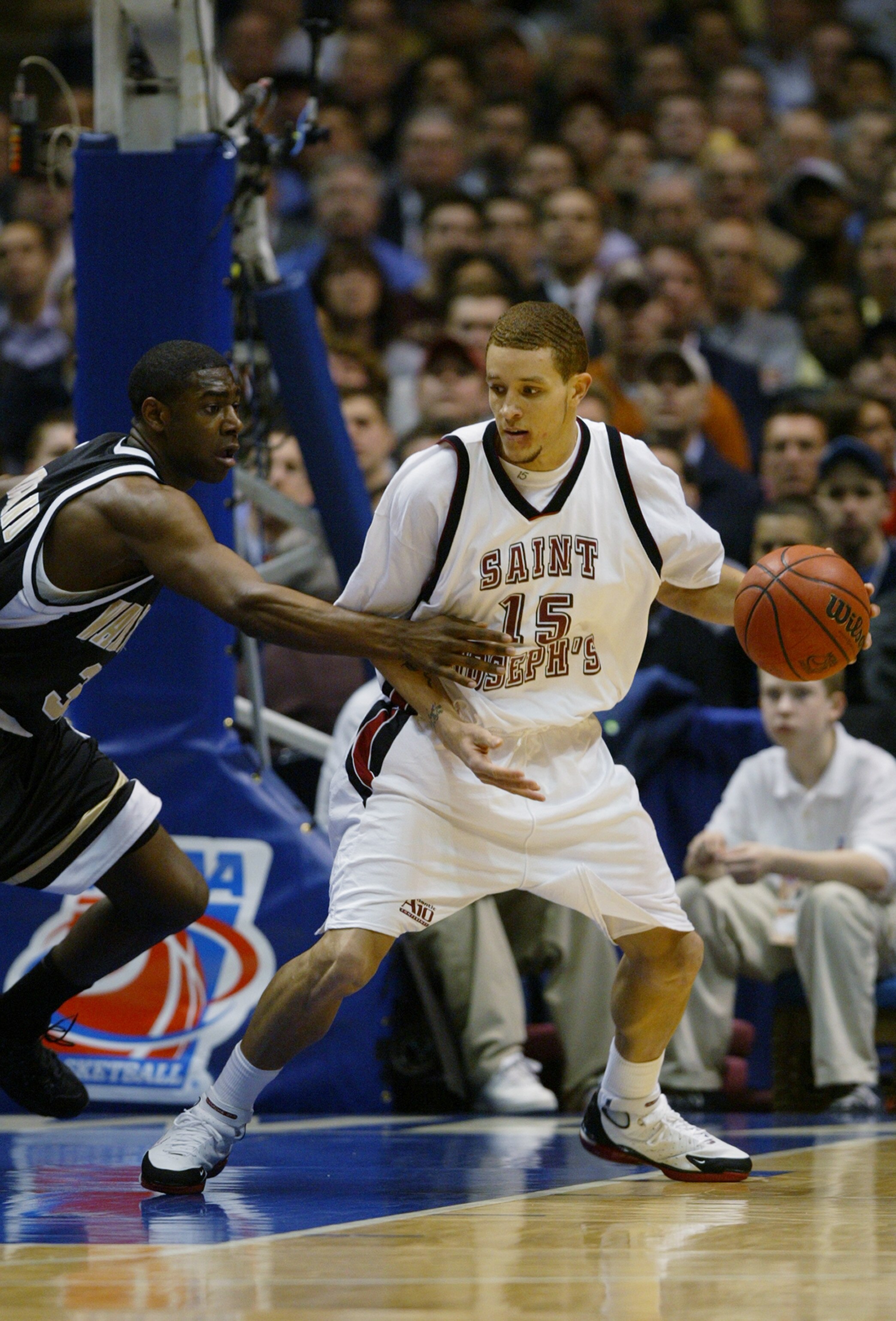 EAST RUTHERFORD, NJ - MARCH 25:  Delonte West #15 of the St. Joseph's Hawks posts up Trent Strickland  #33 of the Wake Forest Demon Deacons during the third round game of the NCAA Division I Men's Basketball Tournament at Continental Airlines Arena on Mar