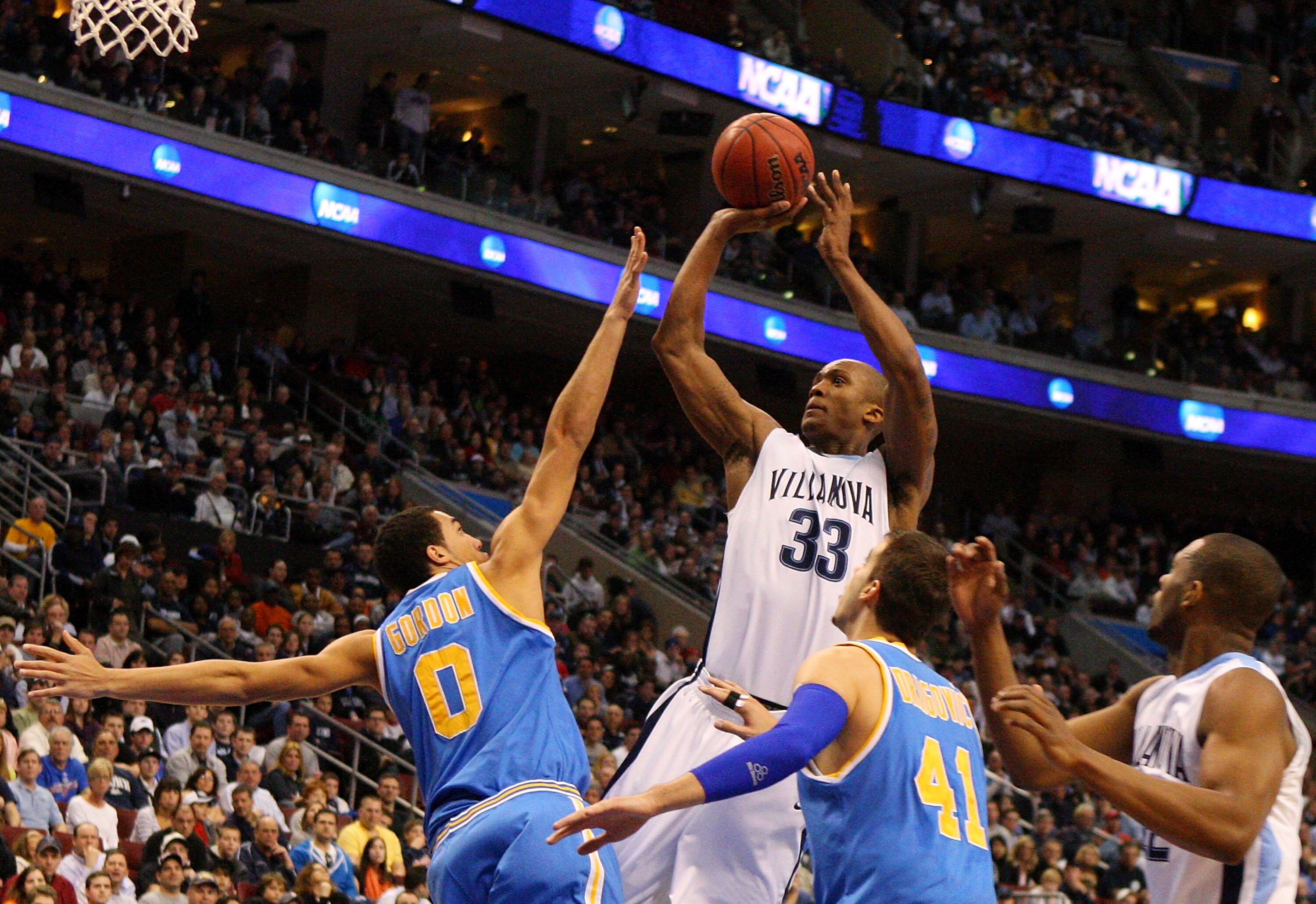 PHILADELPHIA - MARCH 21:  Dante Cunningham #33 of the Villanova Wildcats looks to shoot against Drew Gordon #0 of the UCLA Bruins during the second round of the NCAA Division I Men's Basketball Tournament at the Wachovia Center on March 21, 2009 in Philad