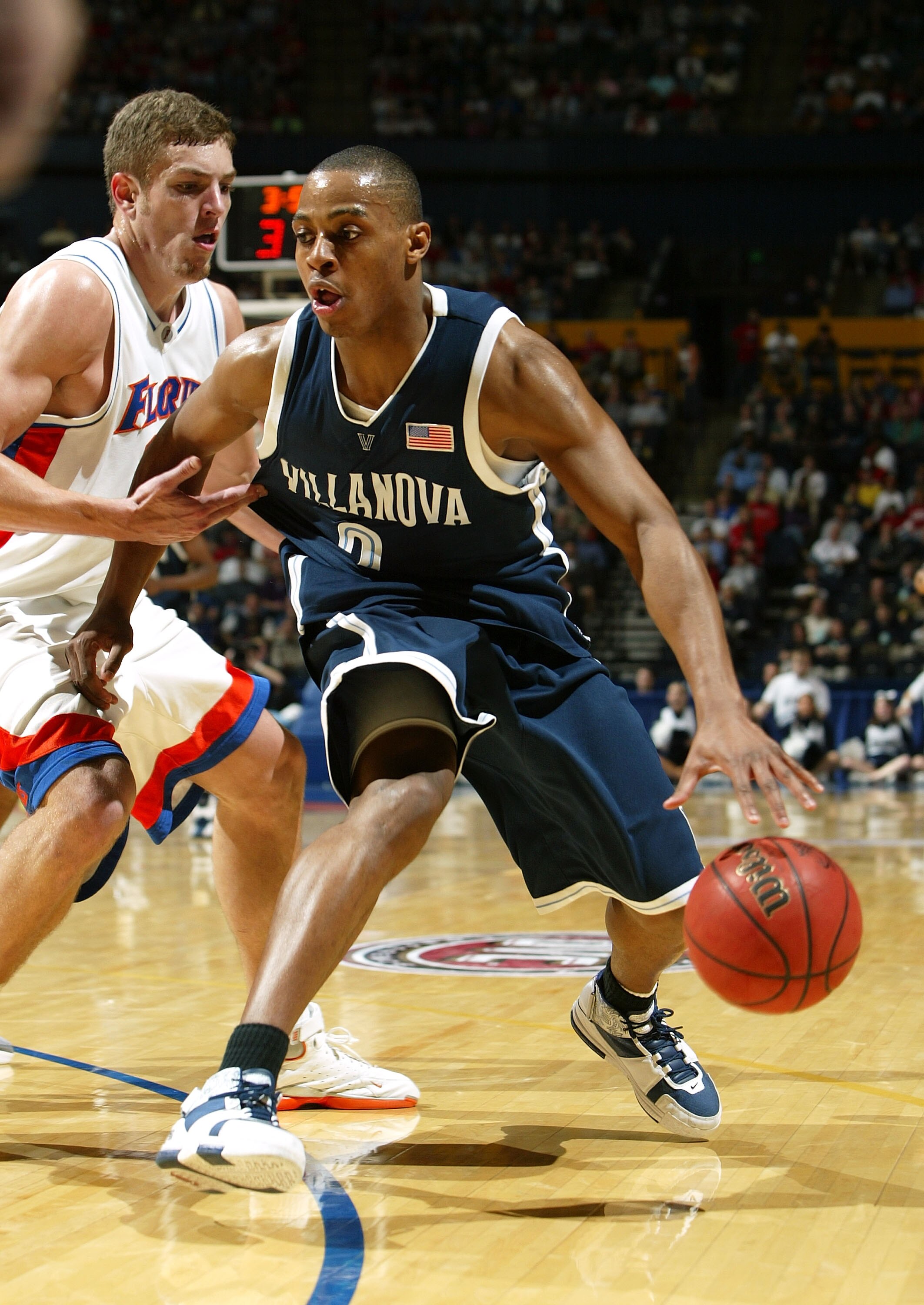 NASHVILLE, TN - MARCH 20:  Randy Foye #2 of the Villanova Wildcats drives past David Lee #24 of the Florida Gators in the second round of the NCAA Division I Men's Basketball Championship at the Gaylord Entertainment Center on March 20, 2005 in Nashville,