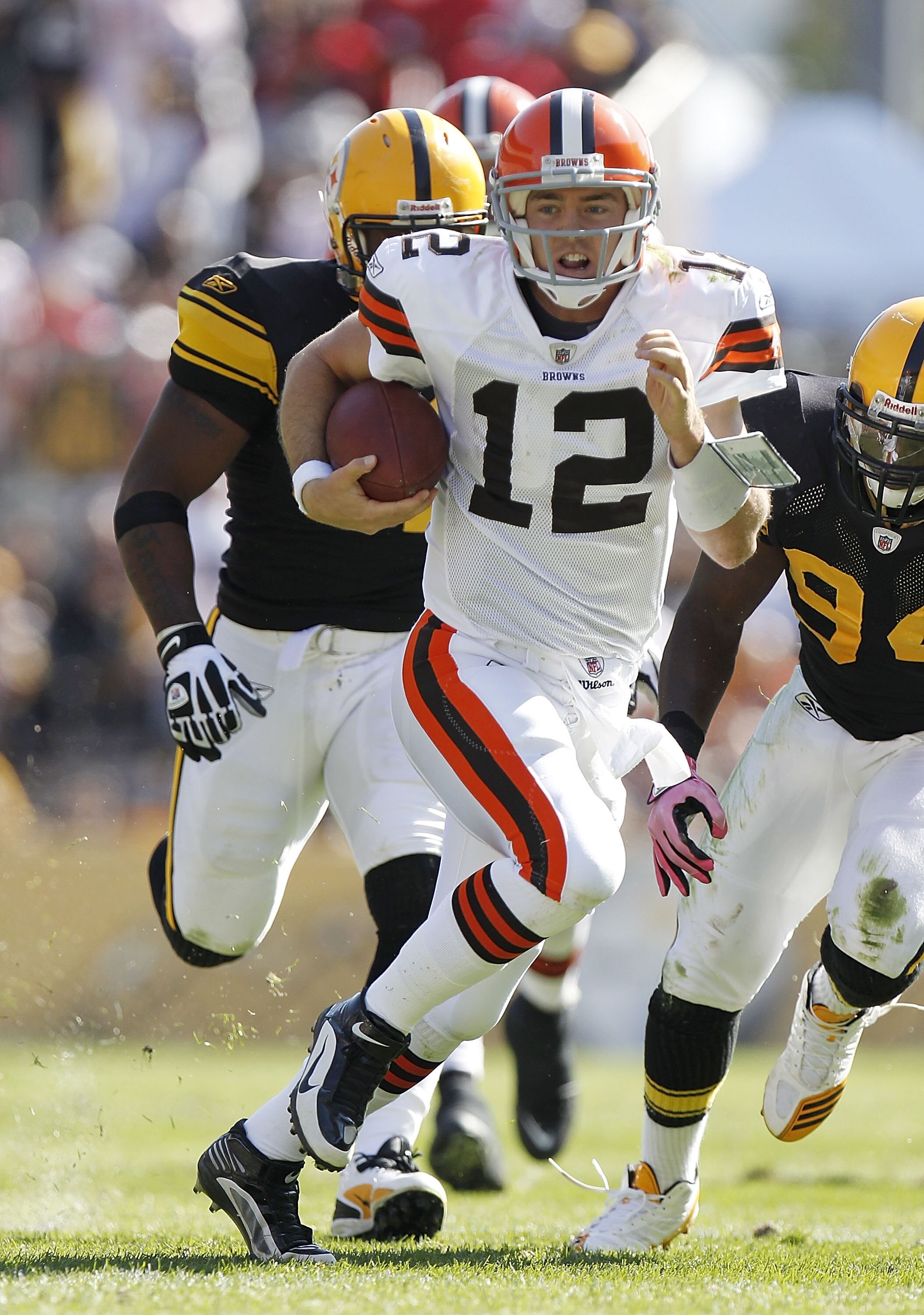 PITTSBURGH - OCTOBER 17: Colt McCoy #12 of the Cleveland Browns looks for running room while playing the Pittsburgh Steelers on October 17, 2010 at Heinz Field in Pittsburgh, Pennsylvania.  (Photo by Gregory Shamus/Getty Images)