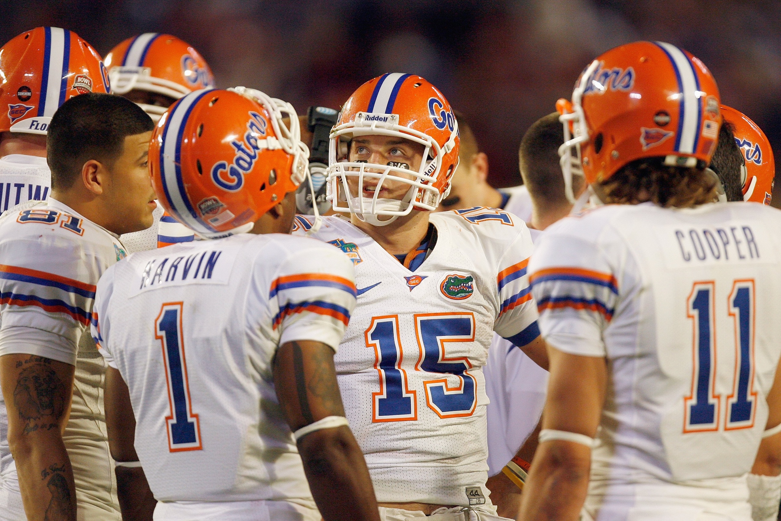 MIAMI - JANUARY 08:  Quarterback Tim Tebow #15 of the Florida Gators huddles against the Oklahoma Sooners during the FedEx BCS National Championship Game at Dolphin Stadium on January 8, 2009 in Miami, Florida.  (Photo by Eliot J. Schechter/Getty Images