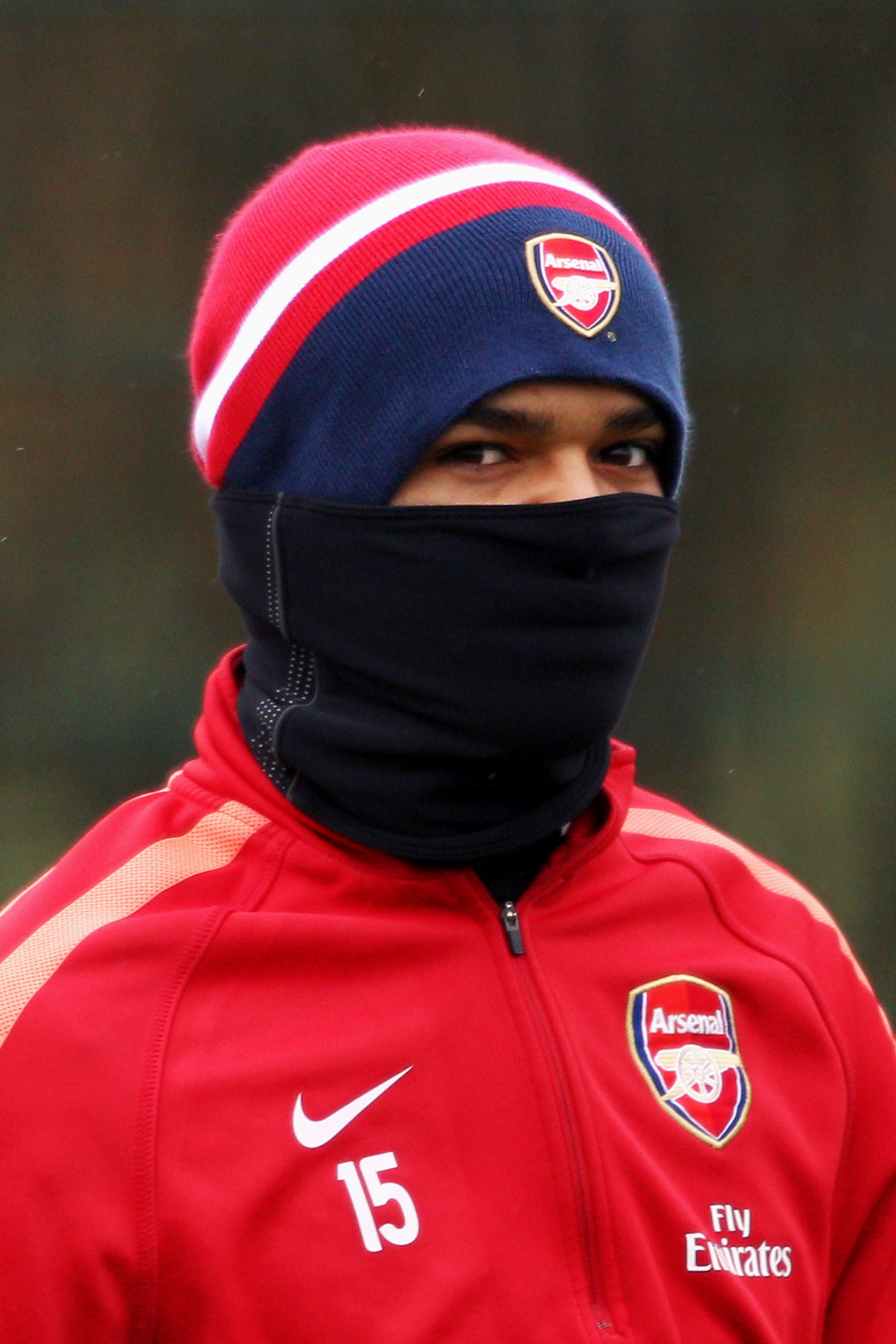 ST ALBANS, ENGLAND - DECEMBER 15:  Denílson covers up from the cold weather during the Arsenal Training Session at London Colney on December 15, 2010 in St Albans, England.  (Photo by Dean Mouhtaropoulos/Getty Images)