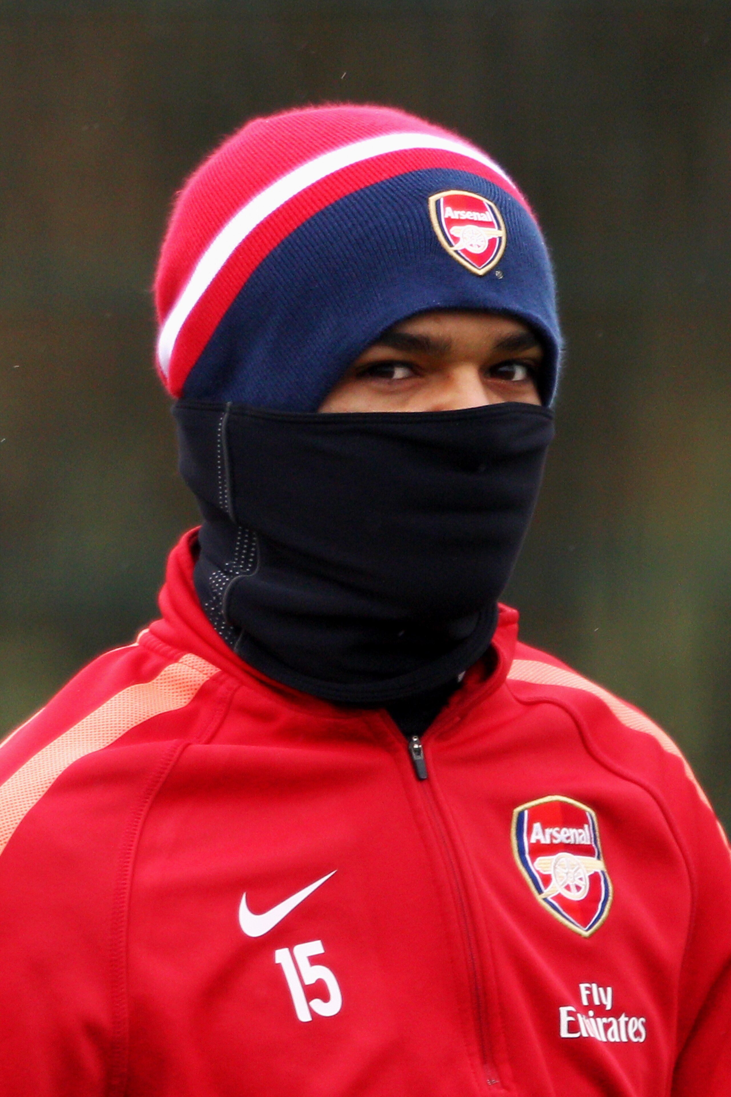 ST ALBANS, ENGLAND - DECEMBER 15:  Denílson covers up from the cold weather during the Arsenal Training Session at London Colney on December 15, 2010 in St Albans, England.  (Photo by Dean Mouhtaropoulos/Getty Images)