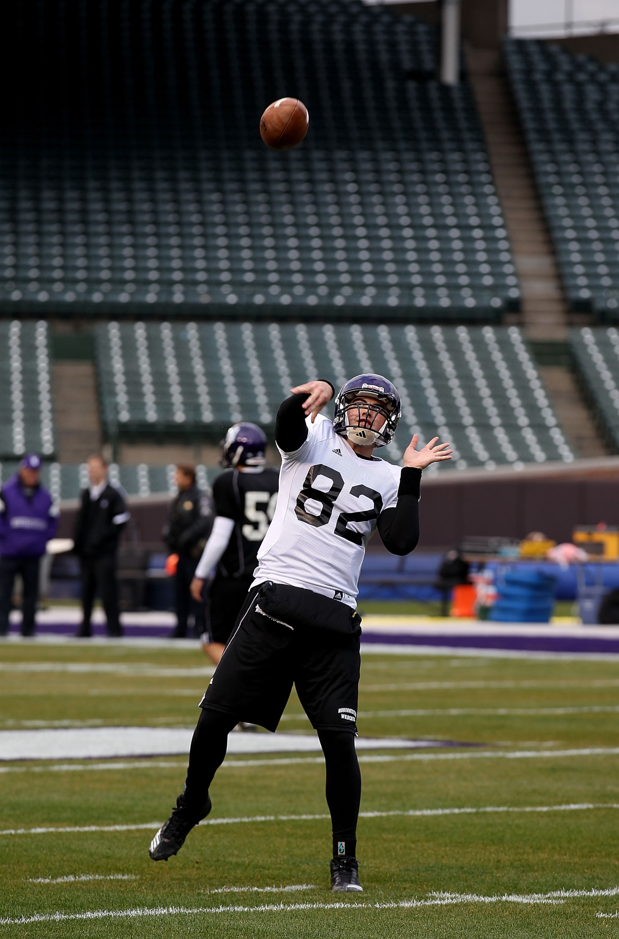 CHICAGO - NOVEMBER 18: Evan Watkins #82 of Northwestern Wildcats, who will start at quarterback, throws a pass during practice for a game against the Illinois Fighting Illini on Saturday November 20 at Wrigley Field on November 18, 2010 in Chicago, Illino