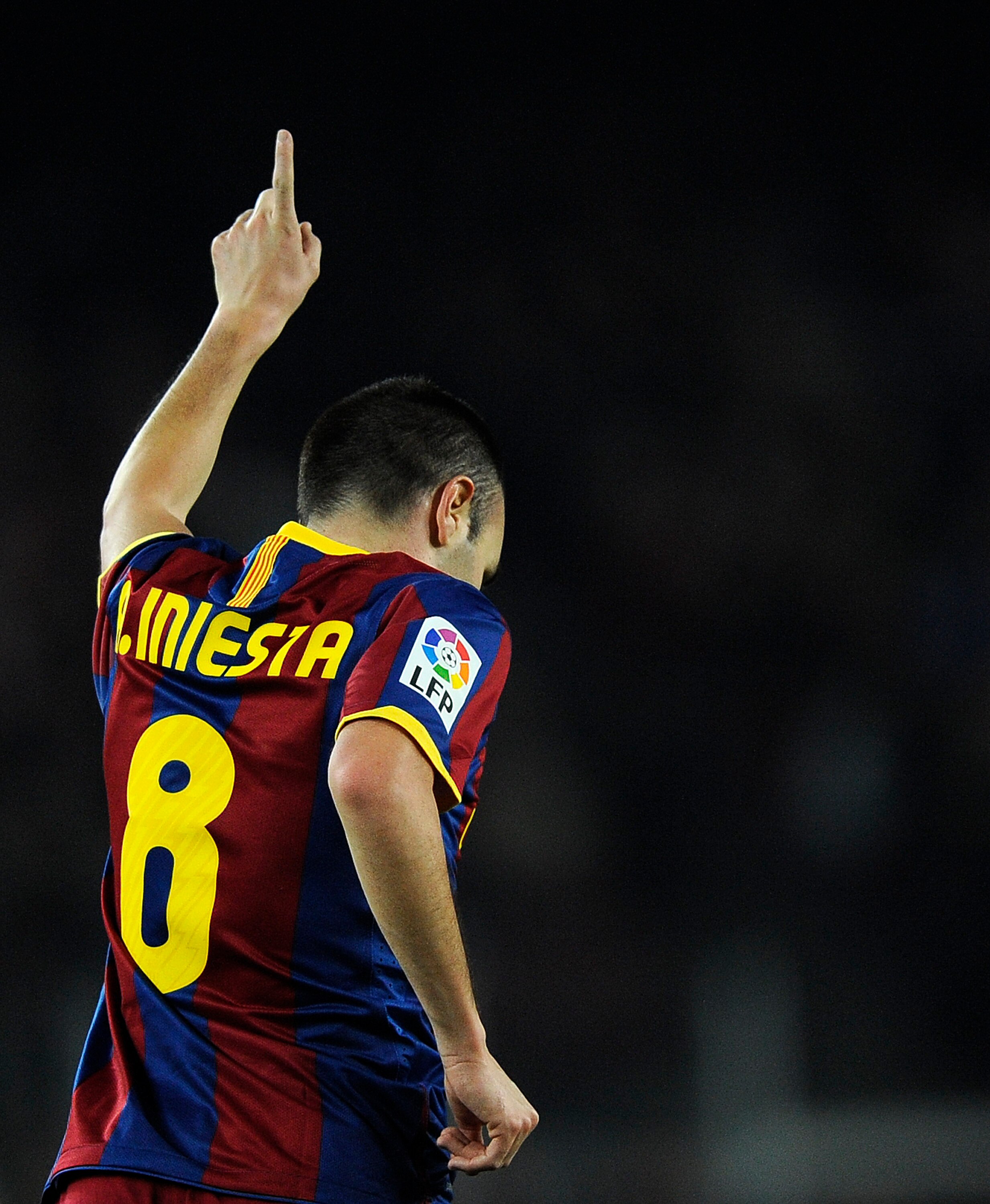 BARCELONA, SPAIN - DECEMBER 12:  Andres Iniesta of Barcelona celebrates after scoring his goal during the La Liga match between Barcelona and Real Sociedad at Camp Nou Stadium on December 12, 2010 in Barcelona, Spain. Barcelona won 5-0.  (Photo by David R
