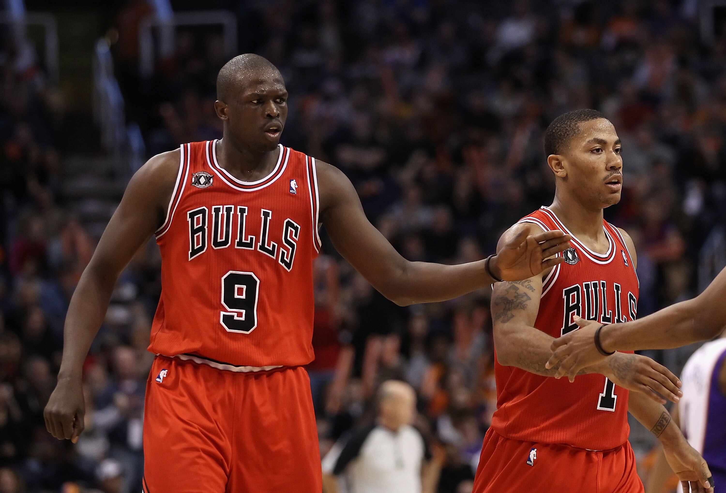 PHOENIX - NOVEMBER 24: Luol Deng #9 of the Chicago Bulls high fives teammates after scoring against the Phoenix Suns late in overtime of the NBA game at US Airways Center on November 24, 2010 in Phoenix, Arizona. The Bulls defeated the Suns 123-115 in do PHOENIX - NOVEMBER 24: Luol Deng #9 of the Chicago Bulls high fives teammates after scoring against the Phoenix Suns late in overtime of the NBA game at US Airways Center on November 24, 2010 in Phoenix, Arizona. The Bulls defeated the Suns 123-115 in do