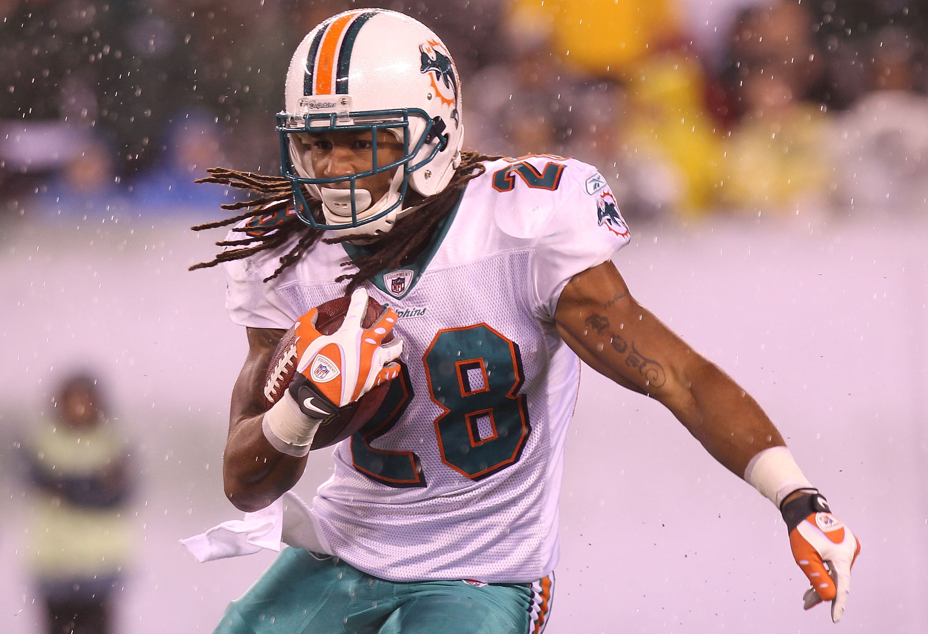 EAST RUTHERFORD, NJ - DECEMBER 12:  Nolan Carroll #28 of the Miami Dolphins rushes against the New York Jets at New Meadowlands Stadium on December 12, 2010 in East Rutherford, New Jersey.  (Photo by Nick Laham/Getty Images)
