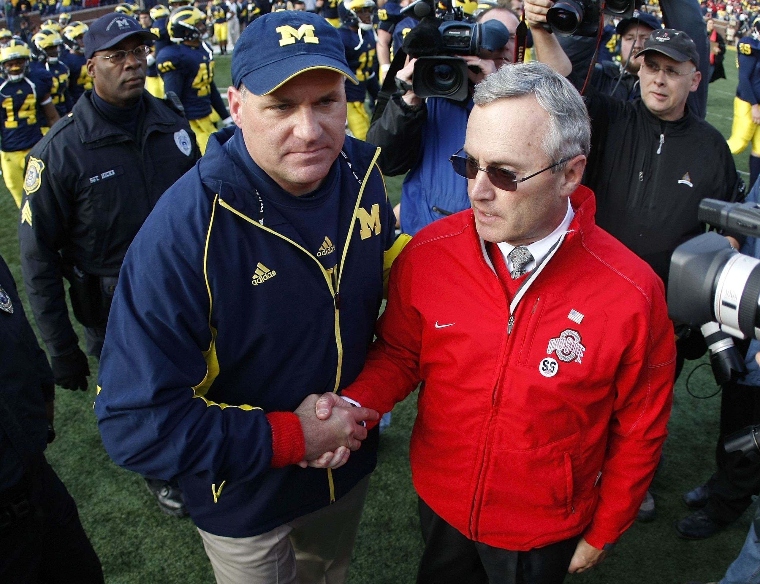 ANN ARBOR, MI - NOVEMBER 21: Head coach Jim Tressel of the Ohio State Buckeyes shakes hands after a 21-10 victory with head coach Rich Rodriguez of the Michigan Wolverines on November 21, 2009 at Michigan Stadium in Ann Arbor, Michigan.  (Photo by Gregory