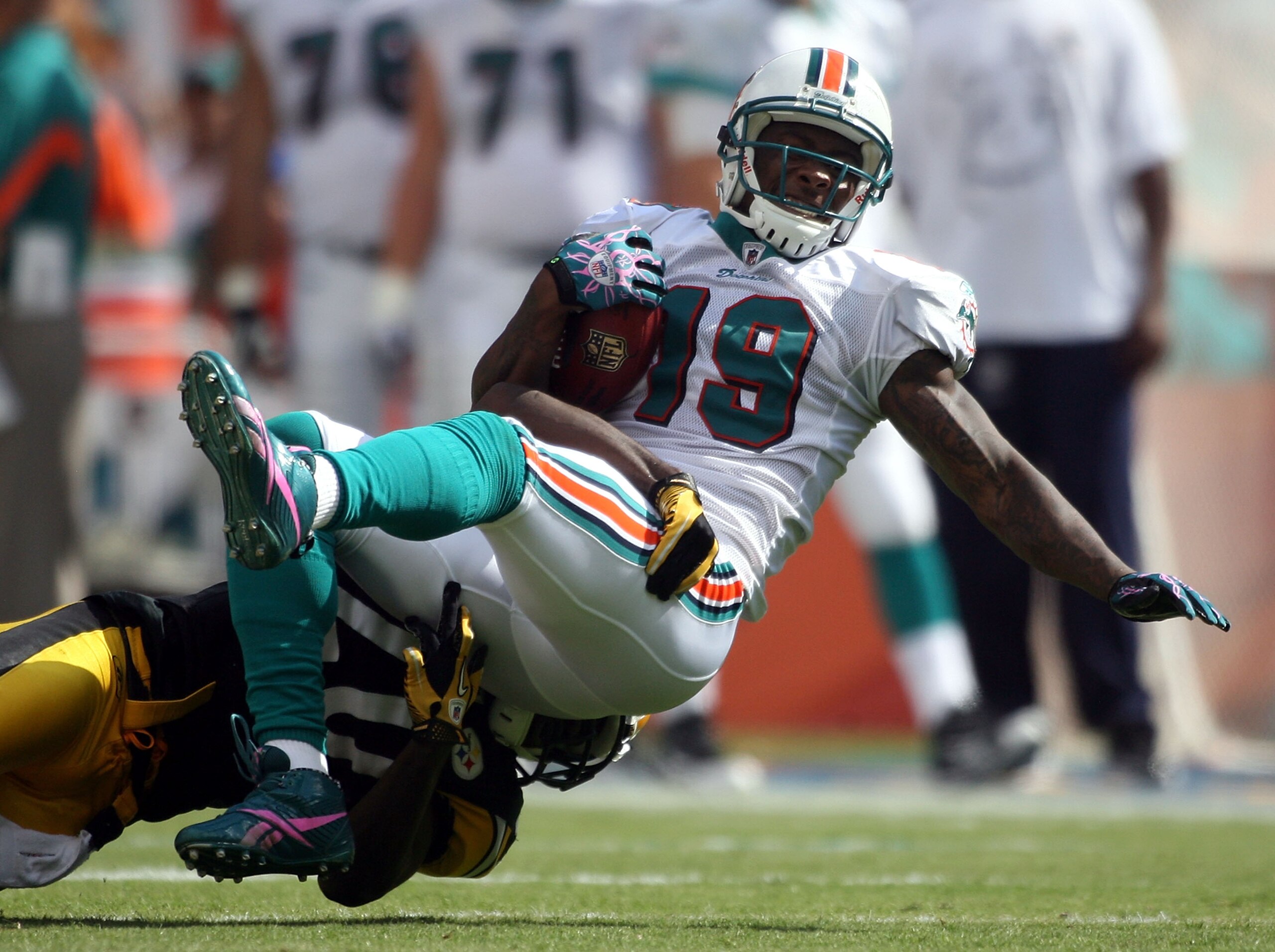 MIAMI - OCTOBER 24: Receiver Brandon Marshall #19 is brought down by the Pittsburgh Steelers at Sun Life Stadium on October 24, 2010 in Miami, Florida. (Photo by Marc Serota/Getty Images) MIAMI - OCTOBER 24: Receiver Brandon Marshall #19 is brought down by the Pittsburgh Steelers at Sun Life Stadium on October 24, 2010 in Miami, Florida. (Photo by Marc Serota/Getty Images)