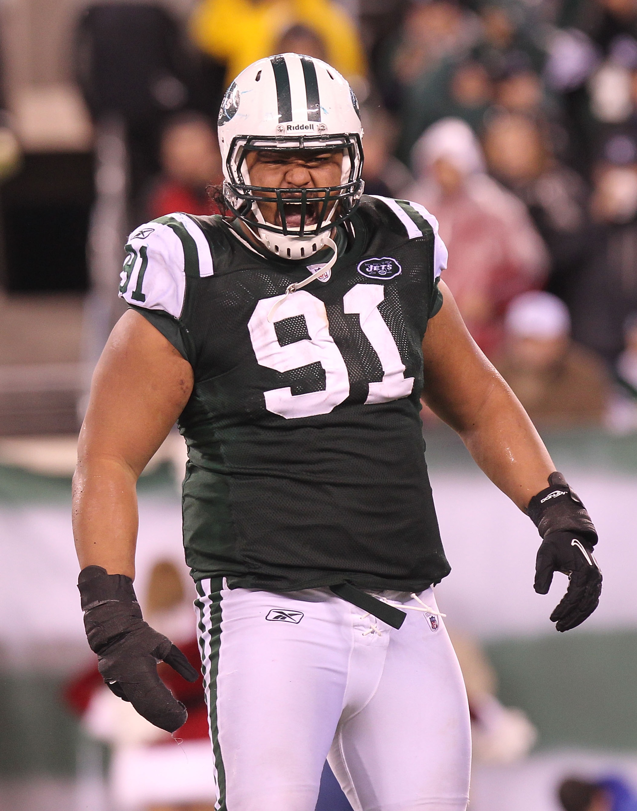 EAST RUTHERFORD, NJ - DECEMBER 12:  Sione Pouha #91 of the New York Jets reacts the Miami Dolphins at New Meadowlands Stadium on December 12, 2010 in East Rutherford, New Jersey.  (Photo by Nick Laham/Getty Images)