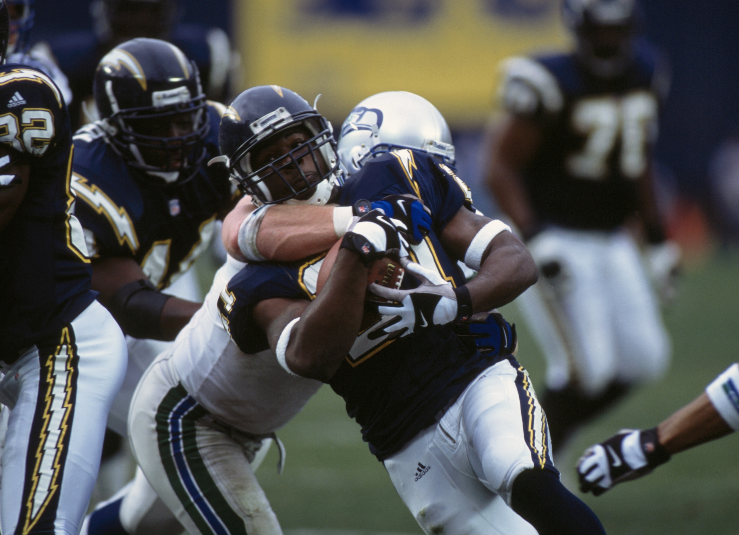 30 Dec 2001:  Running back LaDainian Tomlinson #21 of the San Diego Chargers is tackled during the NFL game against the Seattle Seahawks at Qualcomm Stadium in San Diego, California.  The Seahawks defeated the Chargers 25-22.  \ \ Mandatory Credit: Christ