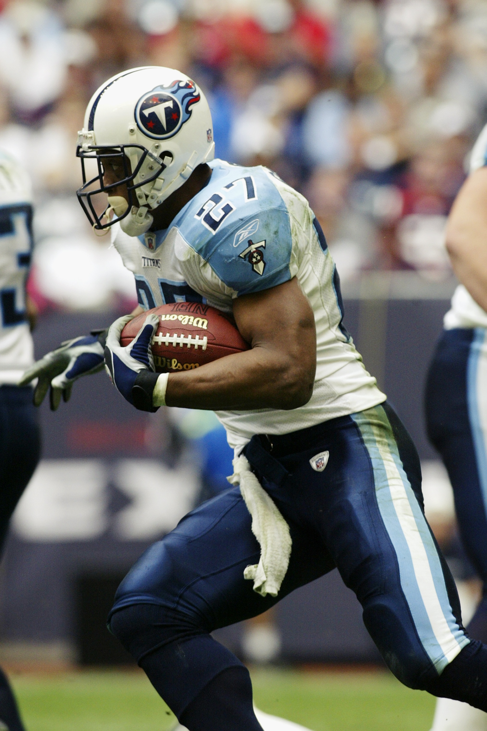 HOUSTON - DECEMBER 29:  Running back Eddie George #27 of the Tennessee Titans rushes for yards during the NFL game against the Houston Texans at Reliant Stadium on December 29, 2002 in Houston, Texas.  The Titans defeated the Texans 13-3.  (Photo by Ronal