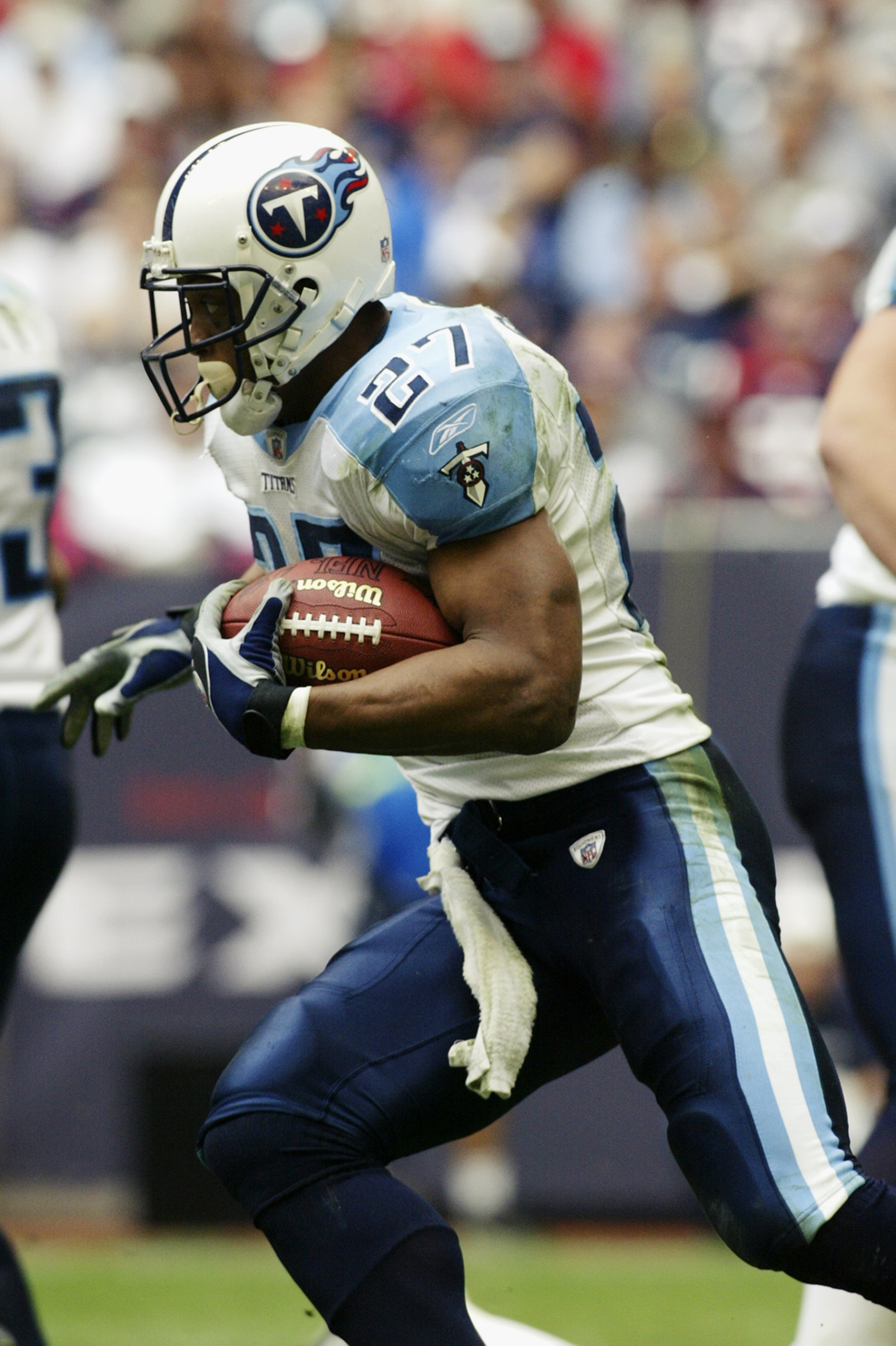 HOUSTON - DECEMBER 29:  Running back Eddie George #27 of the Tennessee Titans rushes for yards during the NFL game against the Houston Texans at Reliant Stadium on December 29, 2002 in Houston, Texas.  The Titans defeated the Texans 13-3.  (Photo by Ronal