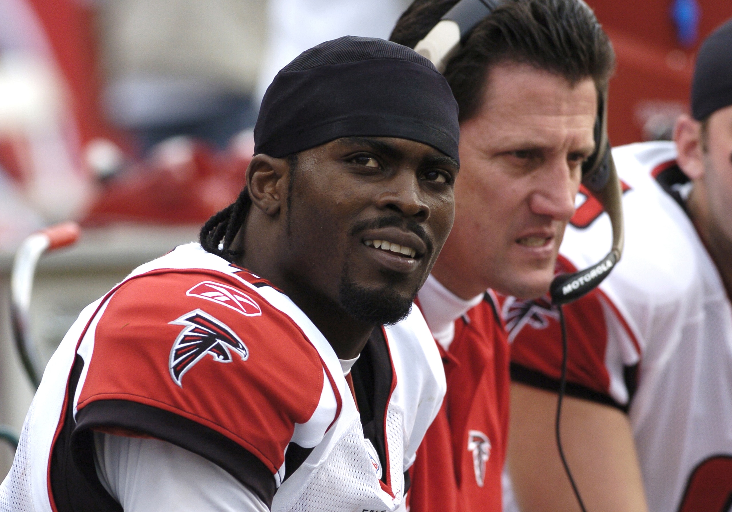 Atlanta Falcons quarterback Michael Vick checks the scoreboard at Raymond James Stadium on December 24, 2005 in Tampa, Flordia.  The Buccaneers defeated the Falcons 27 - 24 in overtime.  (Photo by Al Messerschmidt/Getty Images)