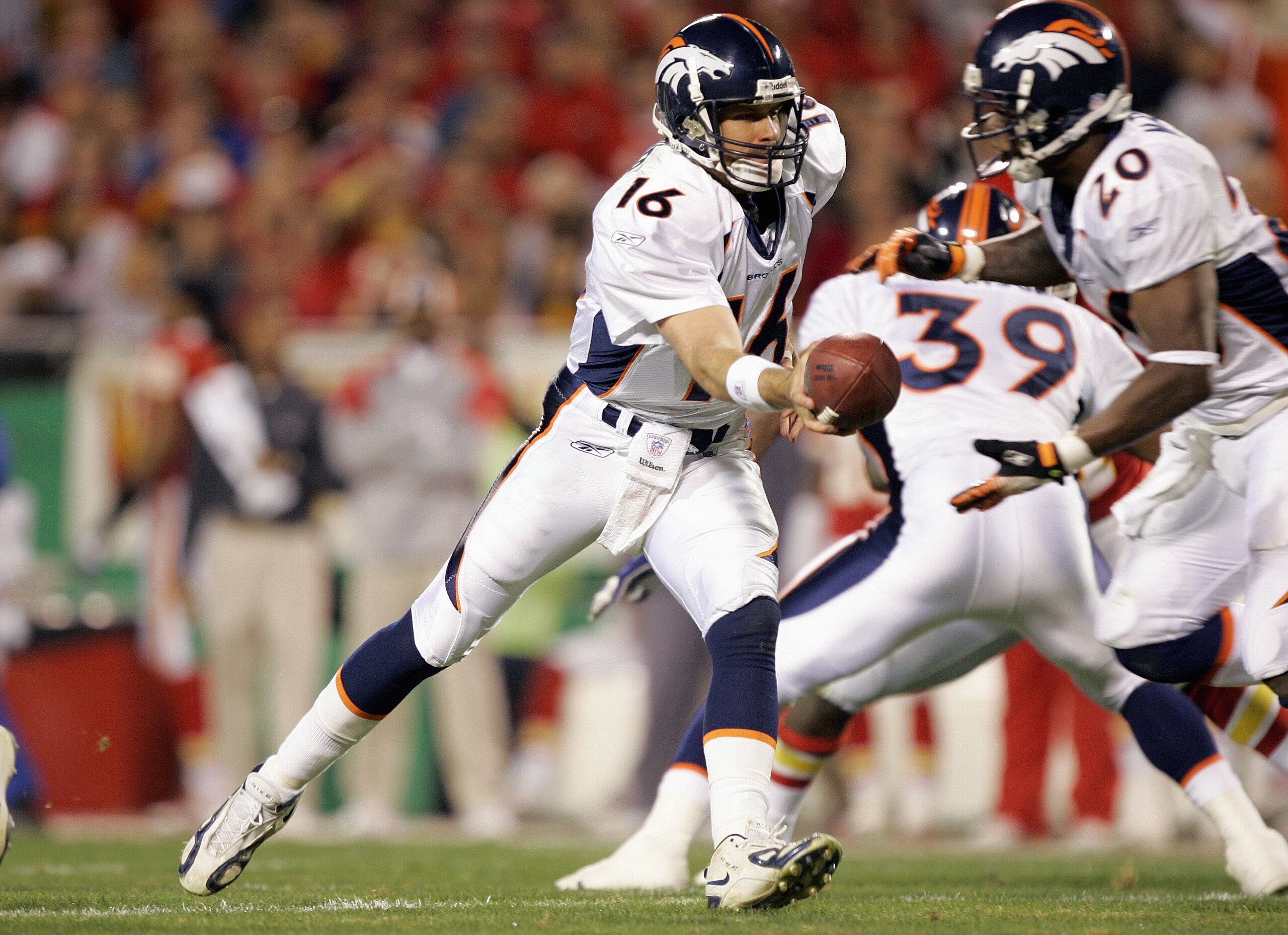 KANSAS CITY, MO - NOVEMBER 23:  Jake Plummer #16 of the Denver Broncos hand off the ball to Kyle Johnson #39 during the game against the Kansas City Chiefs on November 23, 2006 at Arrowhead Stadium in Kansas City, Missouri. The Chiefs won 19-10. (Photo by