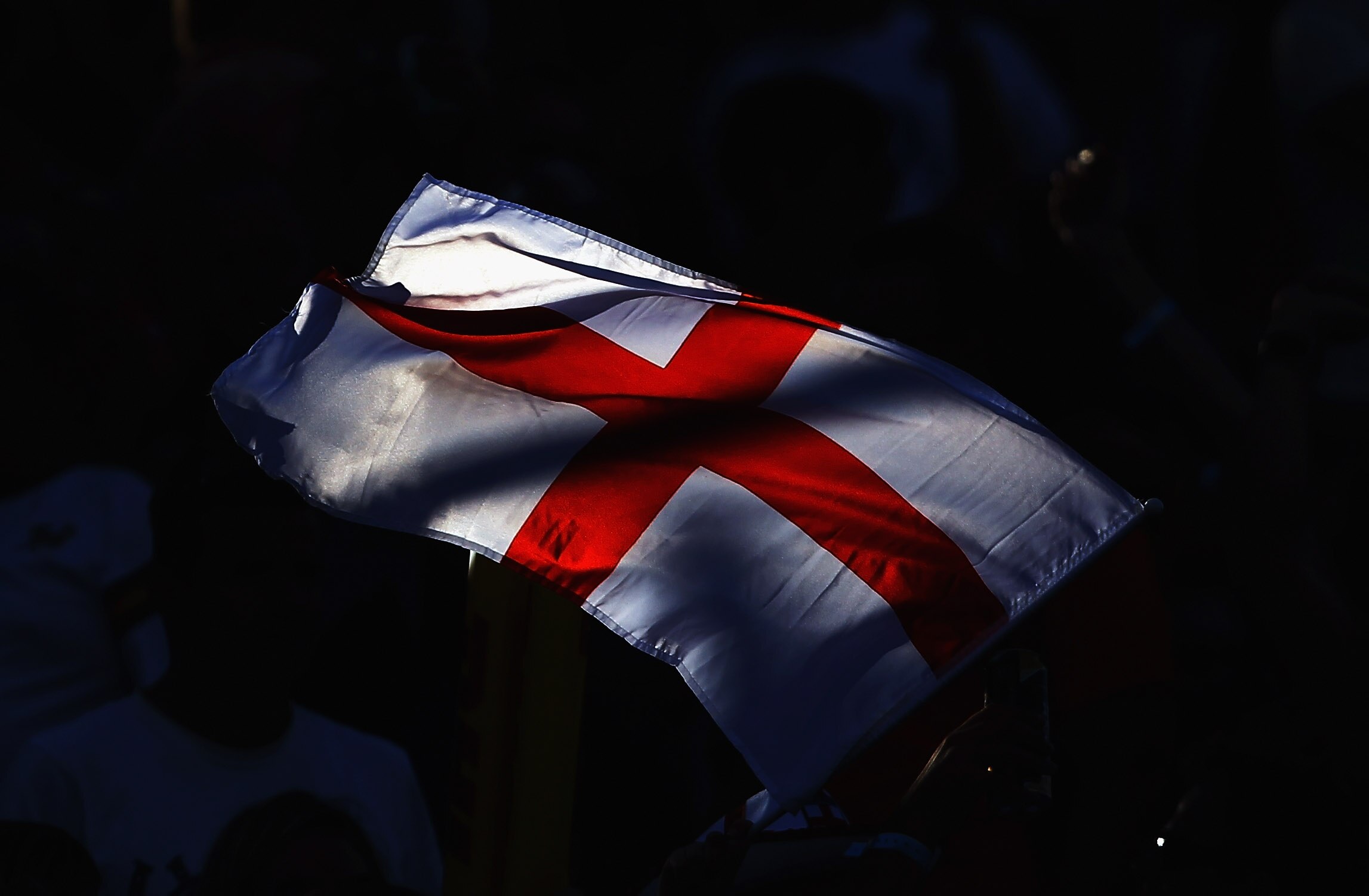 DUBAI, UNITED ARAB EMIRATES - DECEMBER 03: A member of the crowd flies an England flag on day two of the Dubai Rugby Sevens, the opening tournament of the HSBC Sevens World Series at 7he Sevens ground on December 3, 2010 in Dubai, United Arab Emirates.  (