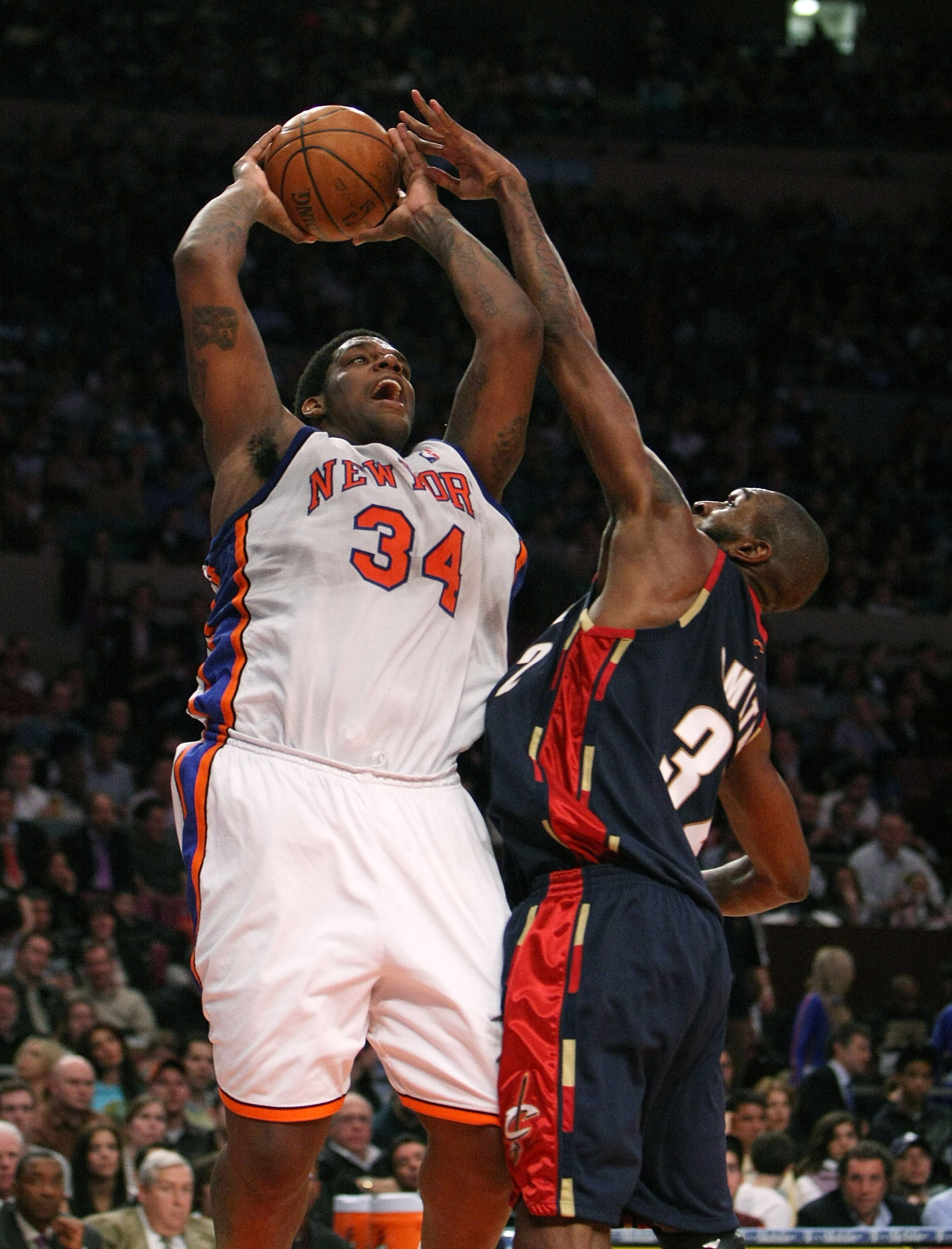 NEW YORK - MARCH 05: Eddy Curry #34 of the New York Knicks shoots against Joe Smith #32 of the Cleveland Cavaliers during their game on March 5, 2008 at Madison Square Garden in New York City. NOTE TO USER: User expressly acknowledges and agrees that, NEW YORK - MARCH 05: Eddy Curry #34 of the New York Knicks shoots against Joe Smith #32 of the Cleveland Cavaliers during their game on March 5, 2008 at Madison Square Garden in New York City. NOTE TO USER: User expressly acknowledges and agrees that,