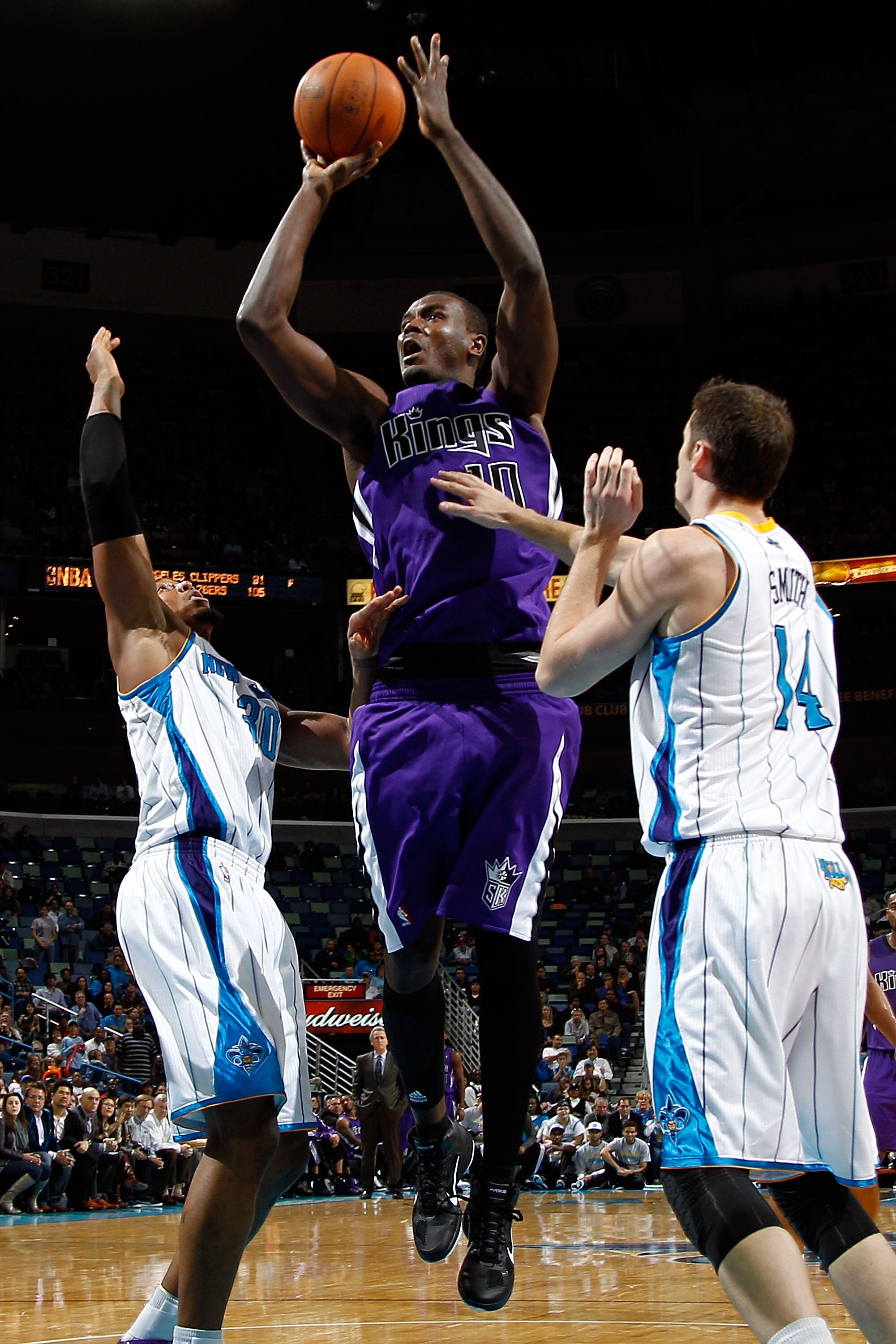 NEW ORLEANS, LA - DECEMBER 15: Samuel Dalembert #10 of the Sacramento Kings shoots the ball over David West #30 and Jason Smith #14 of the New Orleans Hornets at the New Orleans Arena on December 15, 2010 in New Orleans, Louisiana. The Hornets defeated NEW ORLEANS, LA - DECEMBER 15: Samuel Dalembert #10 of the Sacramento Kings shoots the ball over David West #30 and Jason Smith #14 of the New Orleans Hornets at the New Orleans Arena on December 15, 2010 in New Orleans, Louisiana. The Hornets defeated