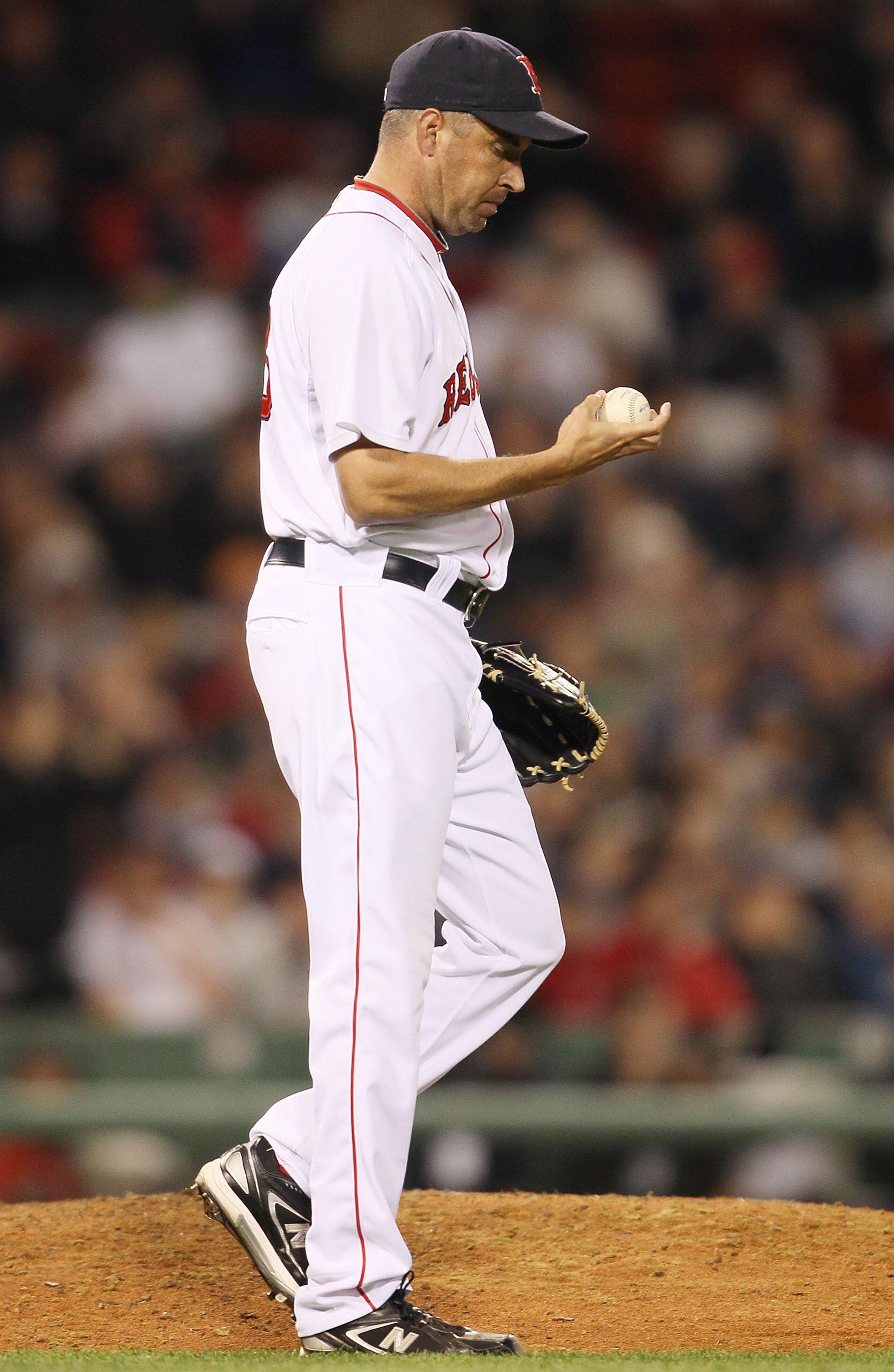 BOSTON - APRIL 06:  Scott Atchison #48 of the Boston Red Sox reacts after giving up a solo home run to Robinson Cano of the New York Yankees in the ninth inning on April 6, 2010 at Fenway Park in Boston, Massachusetts.  (Photo by Elsa/Getty Images)