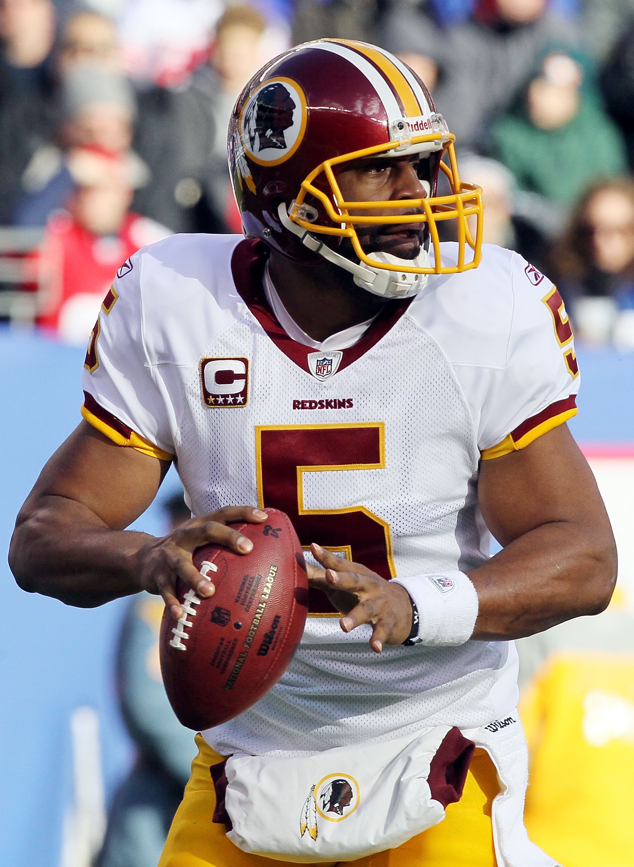 EAST RUTHERFORD, NJ - DECEMBER 05:  Donovan McNabb #5 of the Washington Redskins looks to throw a pass against the New York Giants on December 5, 2010 at the New Meadowlands Stadium in East Rutherford, New Jersey. The Giants defeated the Redskins 31-7.  (