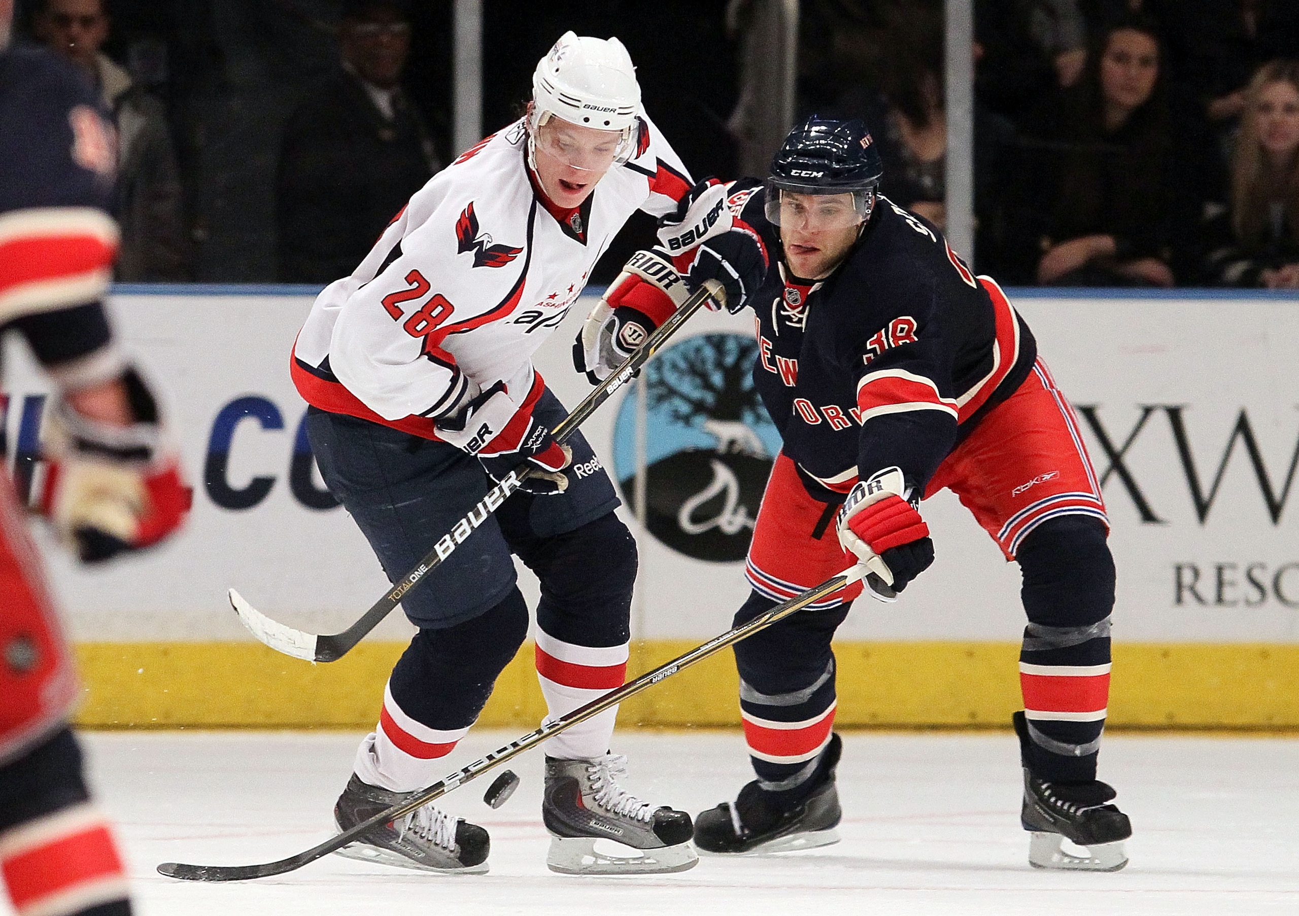 NEW YORK, NY - DECEMBER 12:  Alexander Semin #28 of the Washington Capitals battles for the puck against Michael Sauer #38 of the New York Rangers on December 12, 2010 at Madison Square Garden in New York City.  (Photo by Jim McIsaac/Getty Images)