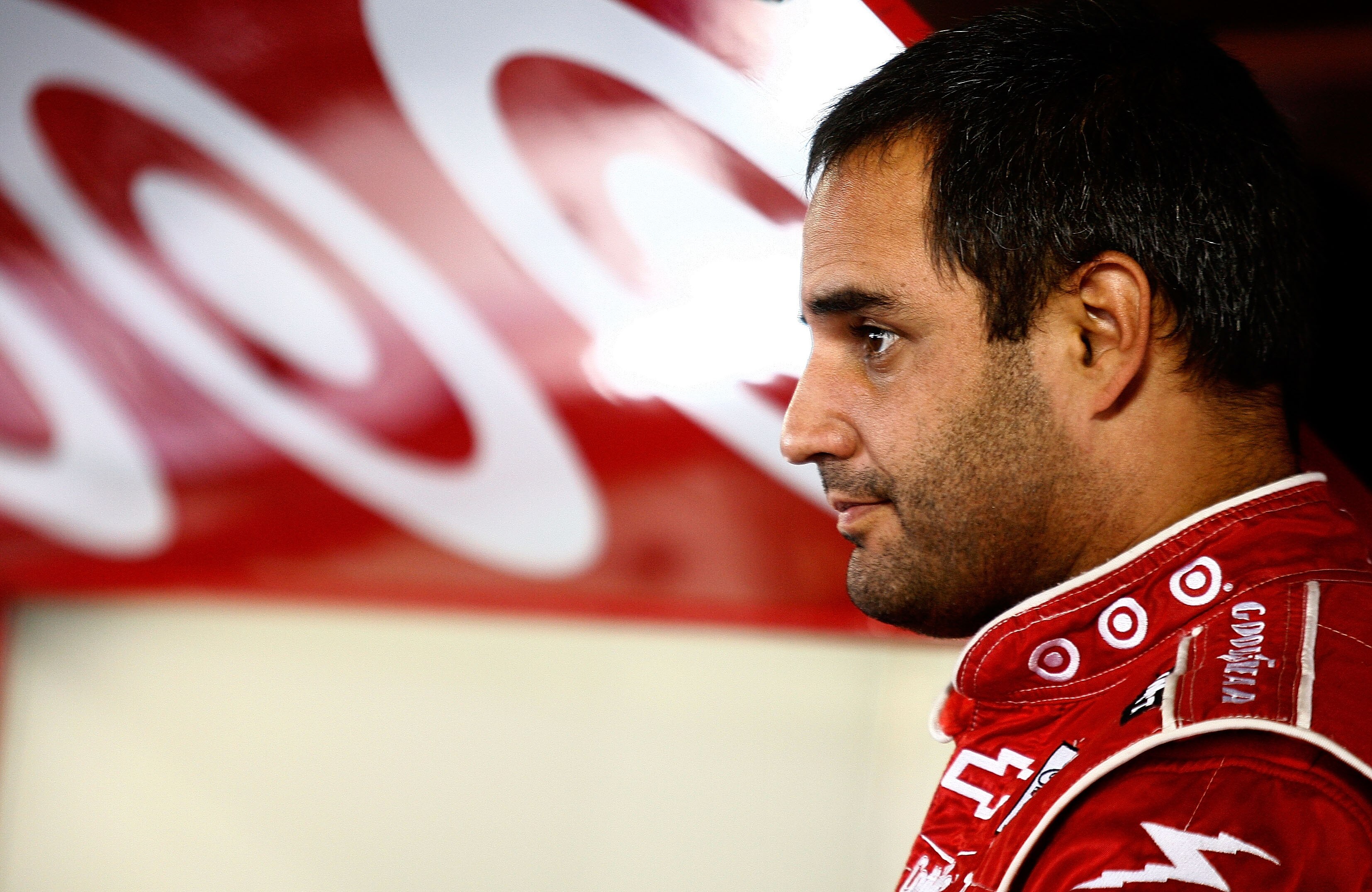MARTINSVILLE, VA - OCTOBER 23:  Juan Pablo Montoya, driver of the #42 Target Chevrolet, stands in the garage during practice for the NASCAR Sprint Cup Series TUMS Fast Relief 500 at Martinsville Speedway on October 23, 2010 in Martinsville, Virginia.  (Ph