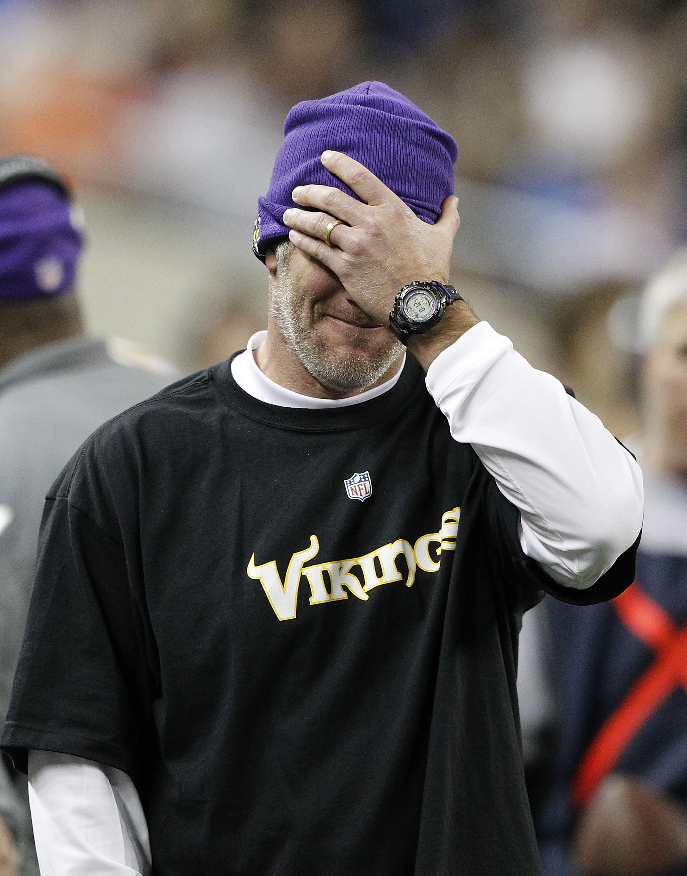 DETROIT - DECEMBER 13:  Quarterback Brett Favre #4 of the Minnesota Vikings covers his face with his hand during the game against the New York Giants at Ford Field on December 13, 2010 in Detroit, Michigan. The Giants defeated the Vikings 21-3.  (Photo by