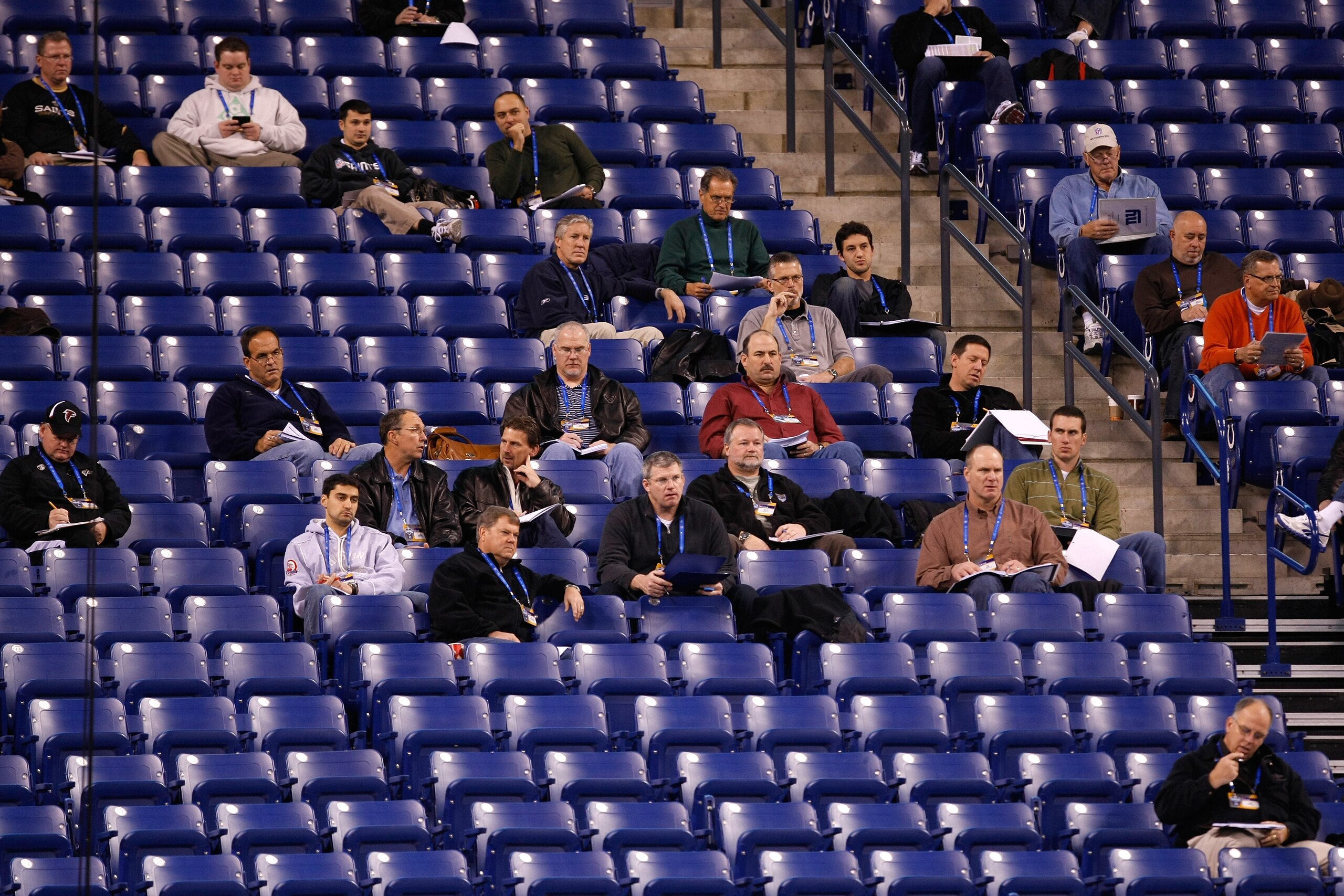 INDIANAPOLIS, IN - FEBRUARY 27: Coaches and scouts from  NFL clubs sit in the stands as the evaluate players on the field during the NFL Scouting Combine presented by Under Armour at Lucas Oil Stadium on February 27, 2010 in Indianapolis, Indiana. (Photo