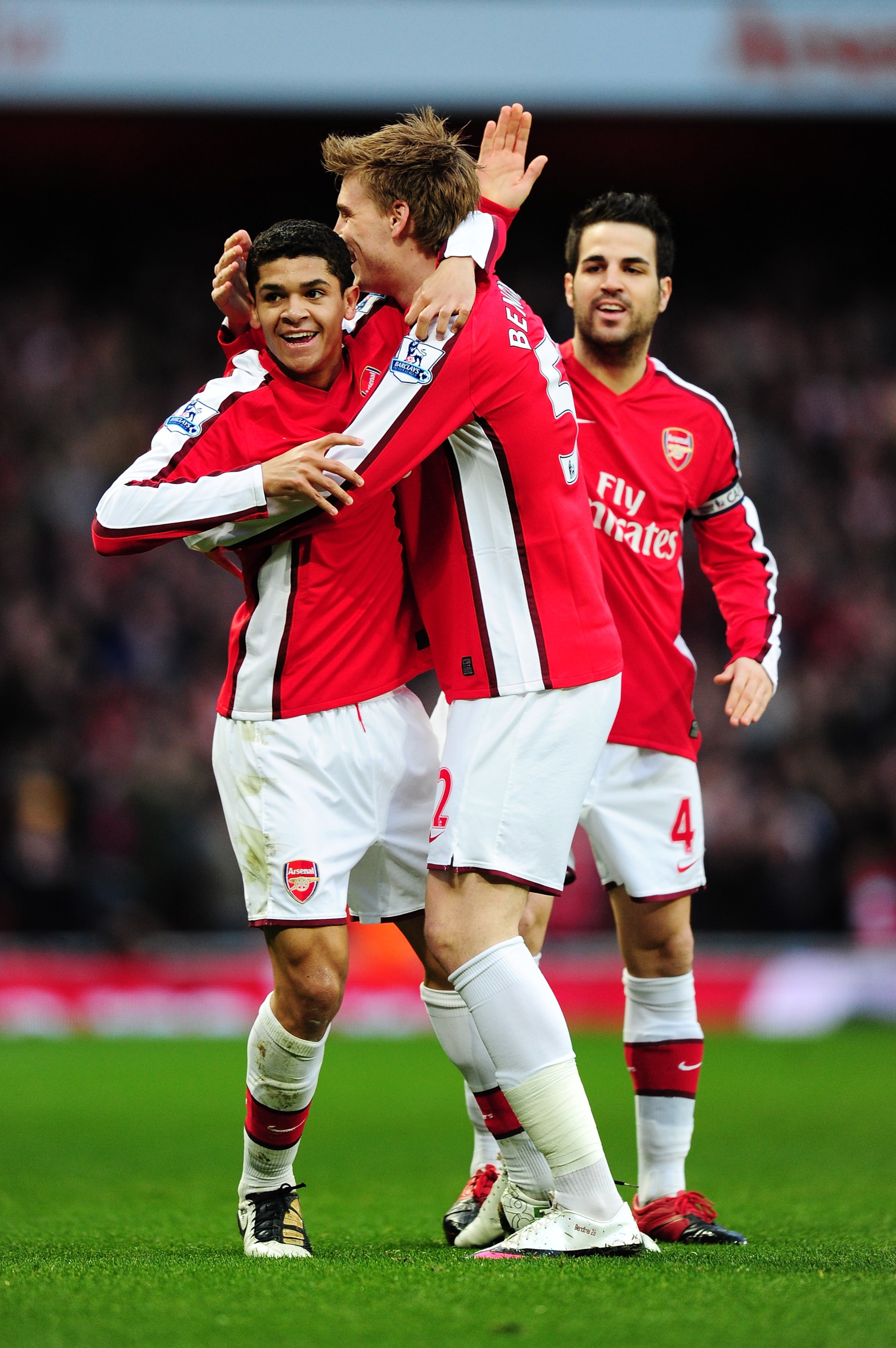 LONDON, ENGLAND - MARCH 20:  Denilson of Arsenal celebrates scoring the opening goal with Nicklas Bendtner and Cesc Fábregas during the Barclays Premier League match between Arsenal and West Ham United at Emirates Stadium on March 20, 2010 in London, Engl
