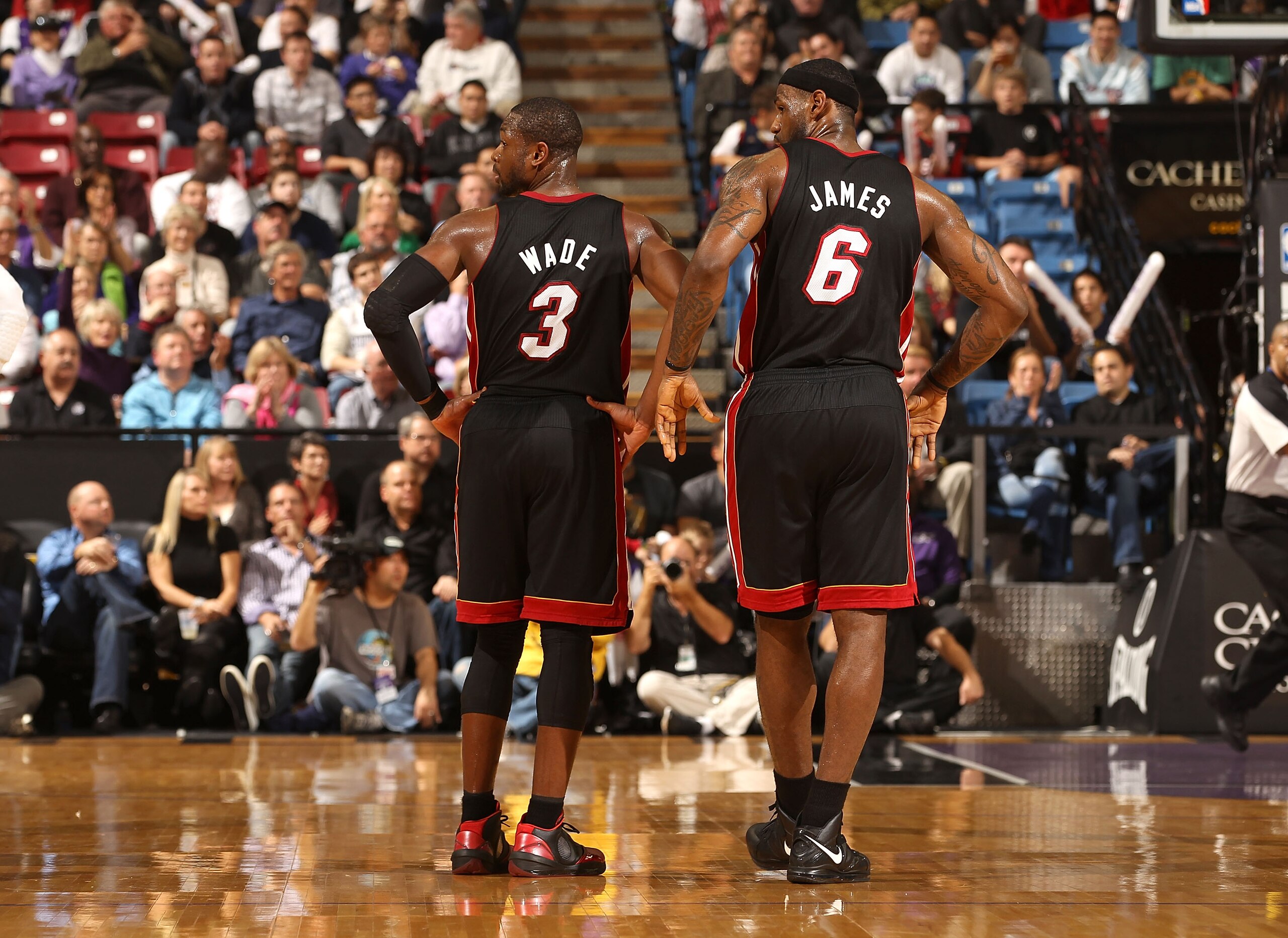 SACRAMENTO, CA - DECEMBER 11: Dwyane Wade #3 and LeBron James #6 of the Miami Heat stand on to the court during the shooting of a technical foul during their game against the Sacramento Kings at ARCO Arena on December 11, 2010 in Sacramento, California. N