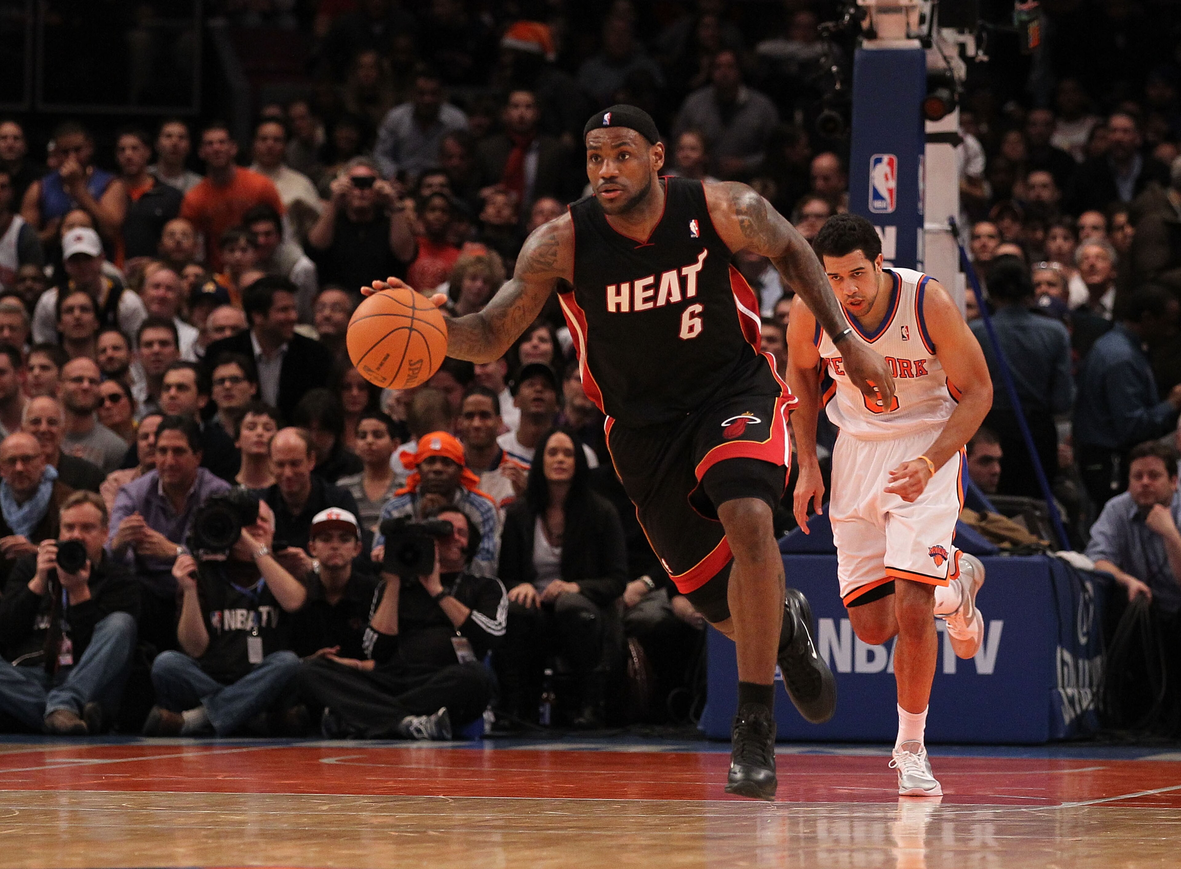NEW YORK - DECEMBER 17: LeBron James #6 of the Miami Heat dribbles the ball as Landry Fields #6 of the New York Knicks gives chase at Madison Square Garden on December 17, 2010 in New York City. NOTE TO USER: User expressly acknowledges and agrees that, NEW YORK - DECEMBER 17: LeBron James #6 of the Miami Heat dribbles the ball as Landry Fields #6 of the New York Knicks gives chase at Madison Square Garden on December 17, 2010 in New York City. NOTE TO USER: User expressly acknowledges and agrees that,