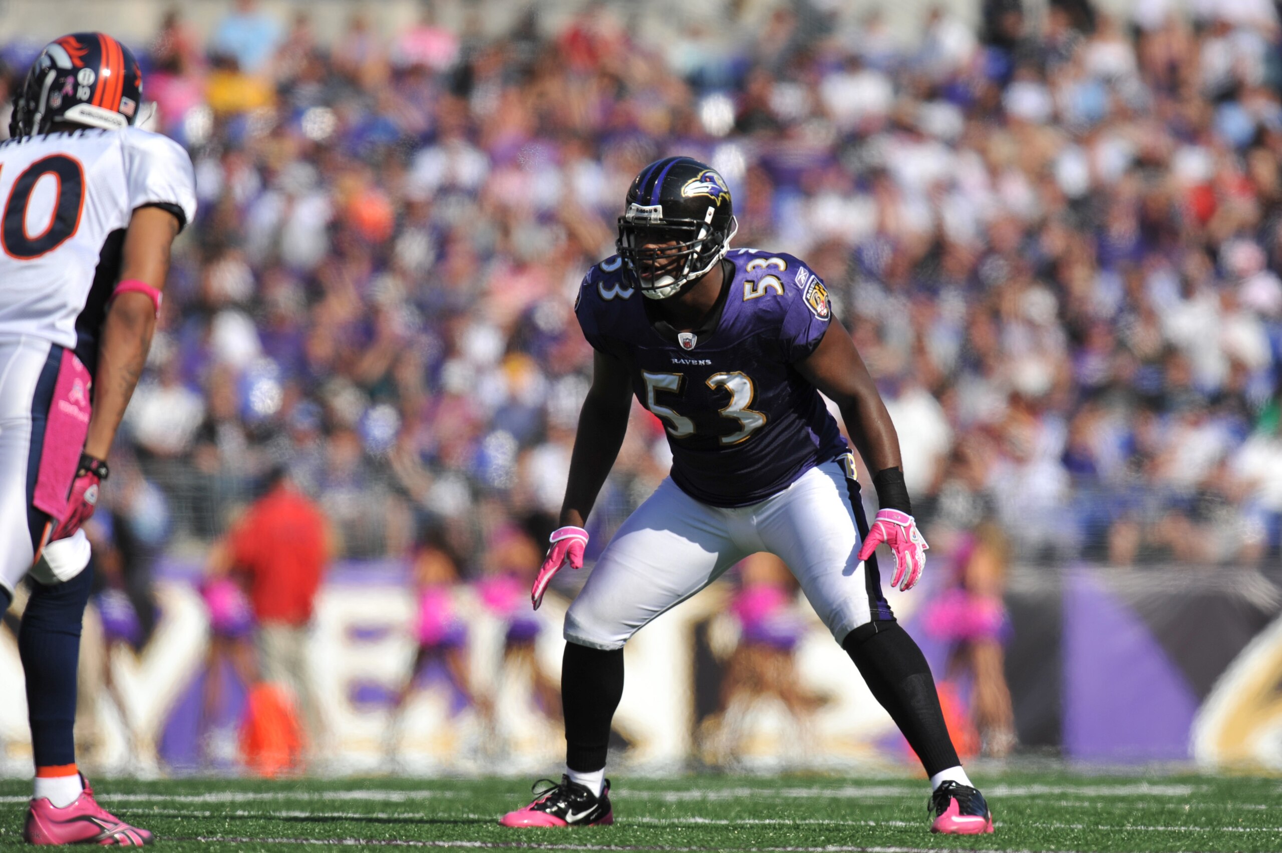 BALTIMORE, MD - OCTOBER 10: Ray Lewis #52 of the Baltimore Ravens defends against the Denver Broncos at M&T Bank Stadium on October 10, 2010 in Baltimore, Maryland. Players wore pink in recognition of Breast Cancer Awareness Month. The Ravens defeated the