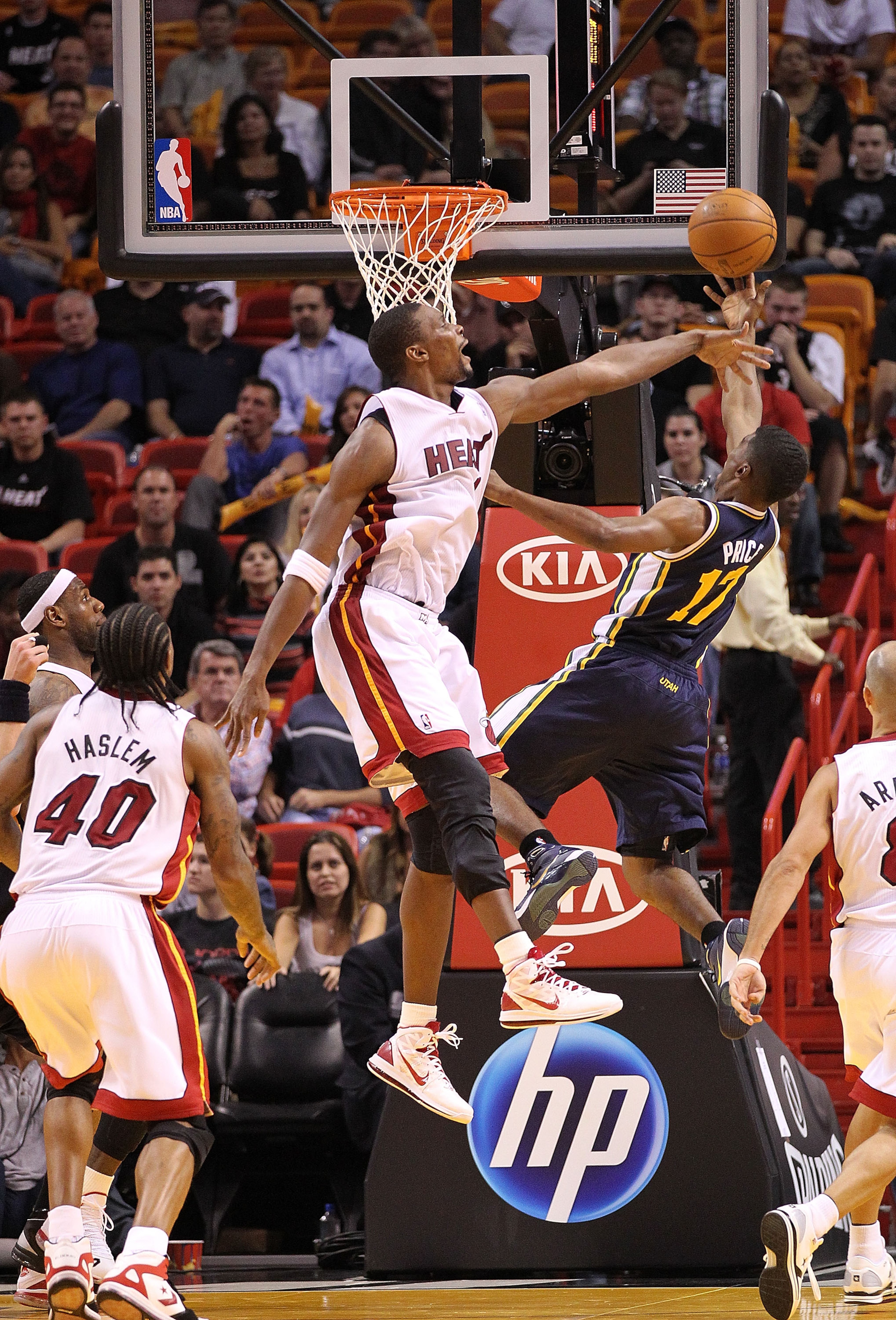 MIAMI - NOVEMBER 09: Chris Bosh #1 of the Miami Heat blocks the shot of Earl Watson #11 during a game against the Utah Jazz at American Airlines Arena on November 9, 2010 in Miami, Florida. NOTE TO USER: User expressly acknowledges and agrees that, by dow MIAMI - NOVEMBER 09: Chris Bosh #1 of the Miami Heat blocks the shot of Earl Watson #11 during a game against the Utah Jazz at American Airlines Arena on November 9, 2010 in Miami, Florida. NOTE TO USER: User expressly acknowledges and agrees that, by dow