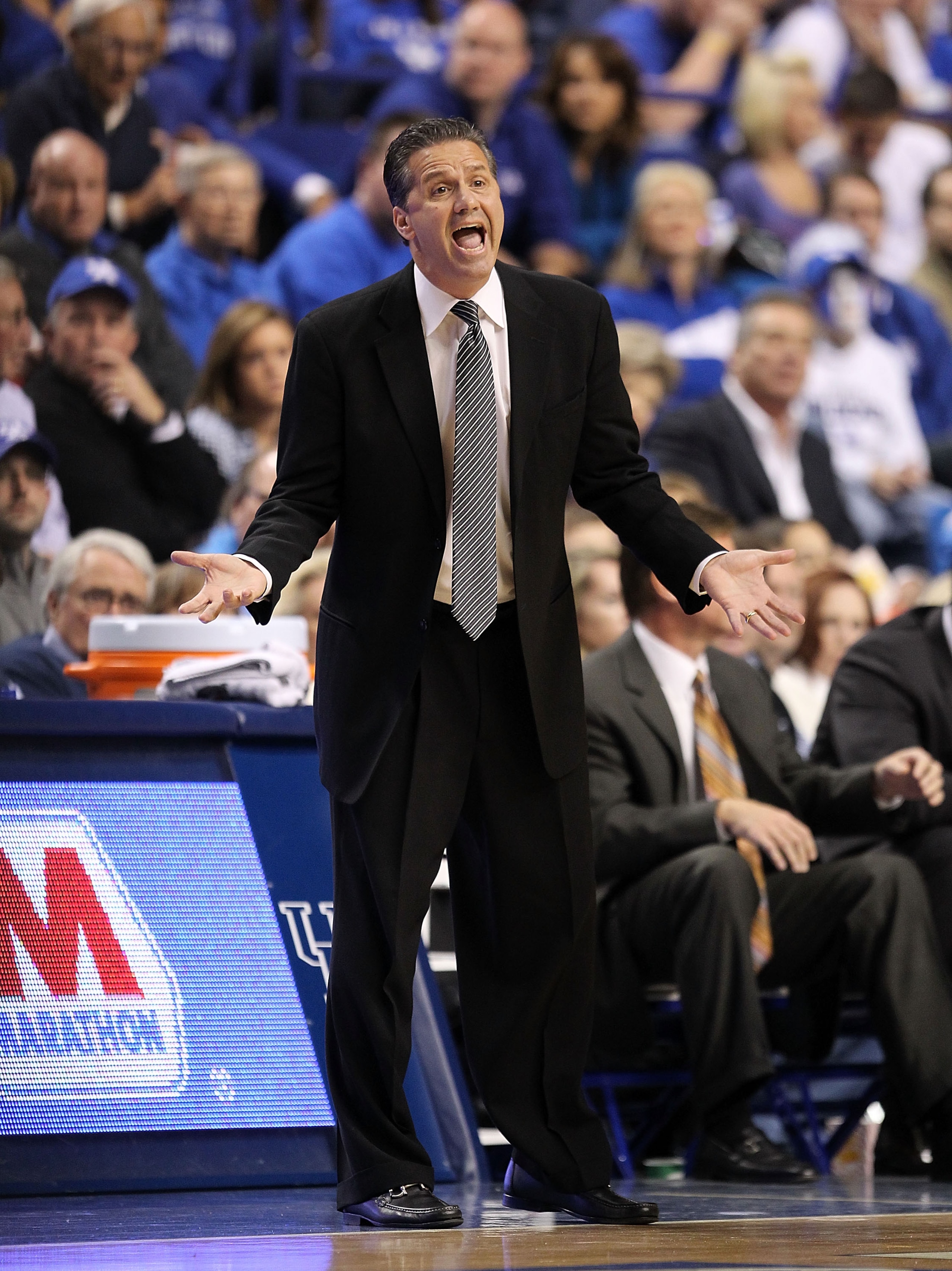 LEXINGTON, KY - DECEMBER 11:  John Calipari the Head Coach of the Kentucky Wildcats gives instructions to his team during the 81-62 victory over the Indiana Hoosiers on December 11, 2010 in Lexington, Kentucky.  (Photo by Andy Lyons/Getty Images)