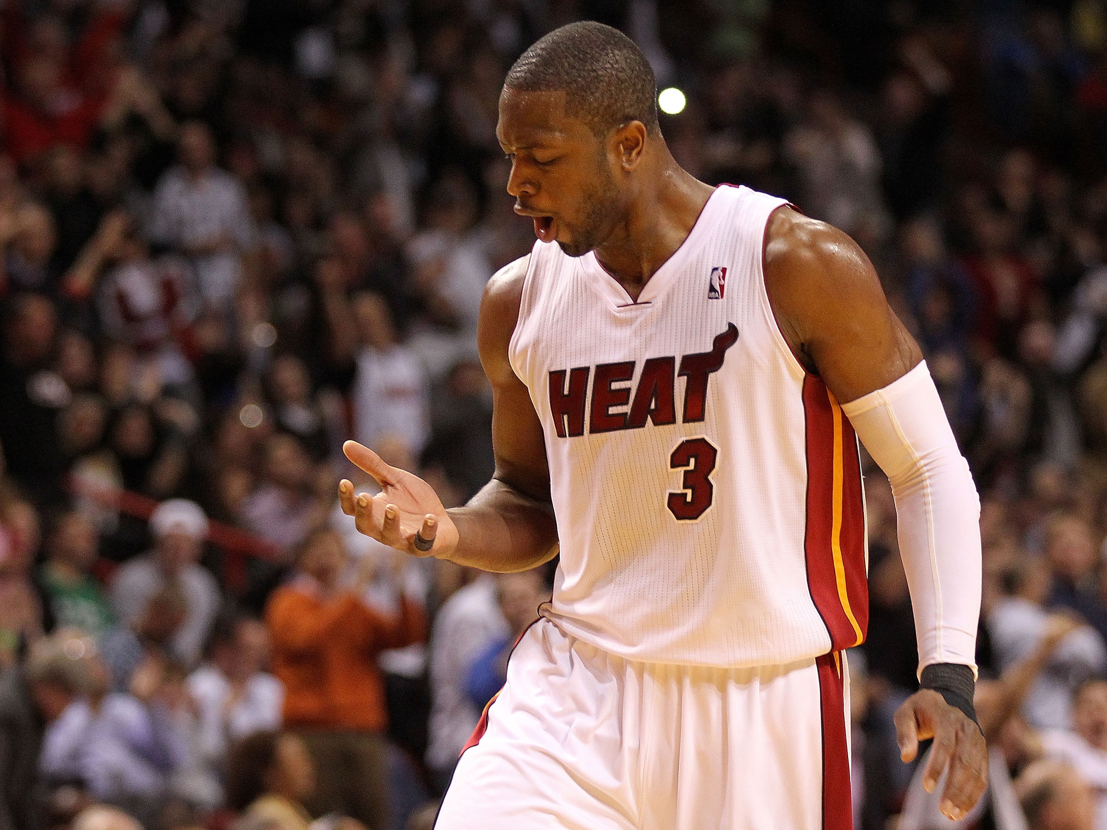 MIAMI, FL - DECEMBER 15: Dwyane Wade #3 of the Miami Heat reacts after making a 3 pointer during a game against the Cleveland Cavaliers at American Airlines Arena on December 15, 2010 in Miami, Florida. NOTE TO USER: User expressly acknowledges and agree MIAMI, FL - DECEMBER 15: Dwyane Wade #3 of the Miami Heat reacts after making a 3 pointer during a game against the Cleveland Cavaliers at American Airlines Arena on December 15, 2010 in Miami, Florida. NOTE TO USER: User expressly acknowledges and agree