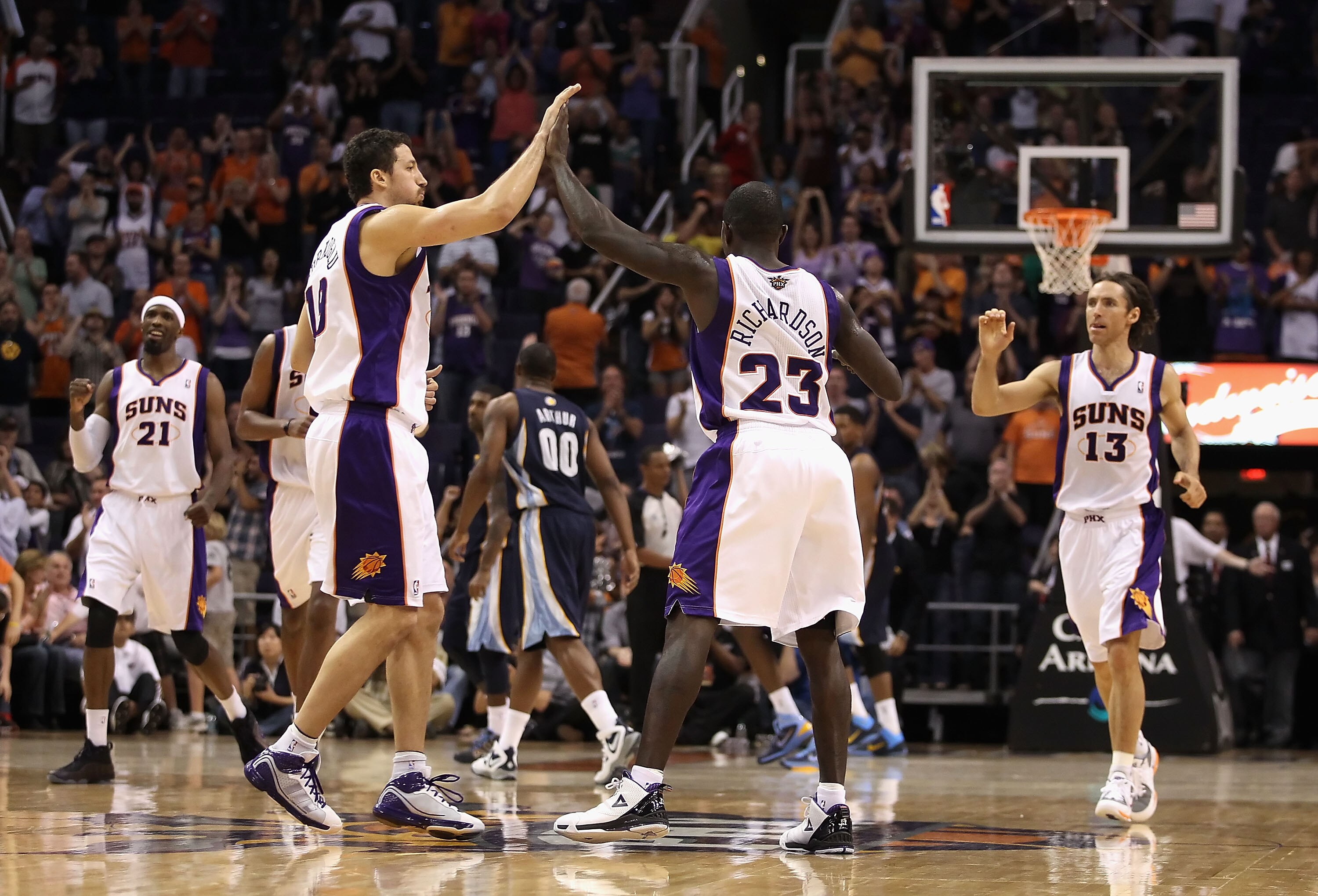 PHOENIX - NOVEMBER 05:  Hedo Turkoglu #19 of the Phoenix Suns high fives teammate Jason Richardson #23 after Richardson hit a basket late in the NBA game against the Memphis Grizzlies at US Airways Center on November 5, 2010 in Phoenix, Arizona. The Suns