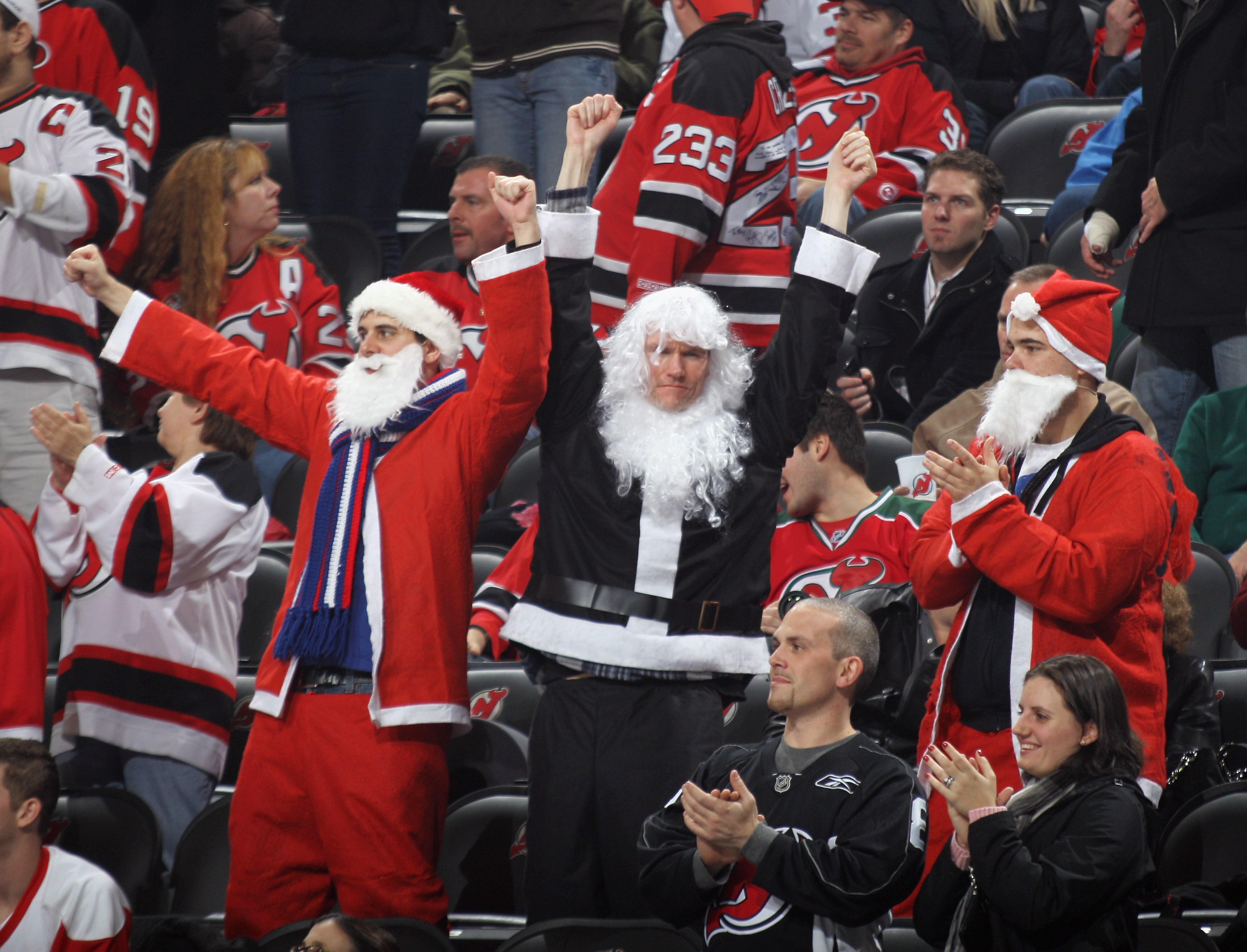 NEWARK, NJ - DECEMBER 11: New Jersey Devils fans celebrate a third period goal against the Detroit Red Wings at the Prudential Center on December 11, 2010 in Newark, New Jersey. The Red Wings defeated the Devils 4-1. (Photo by Bruce Bennett/Getty Images)