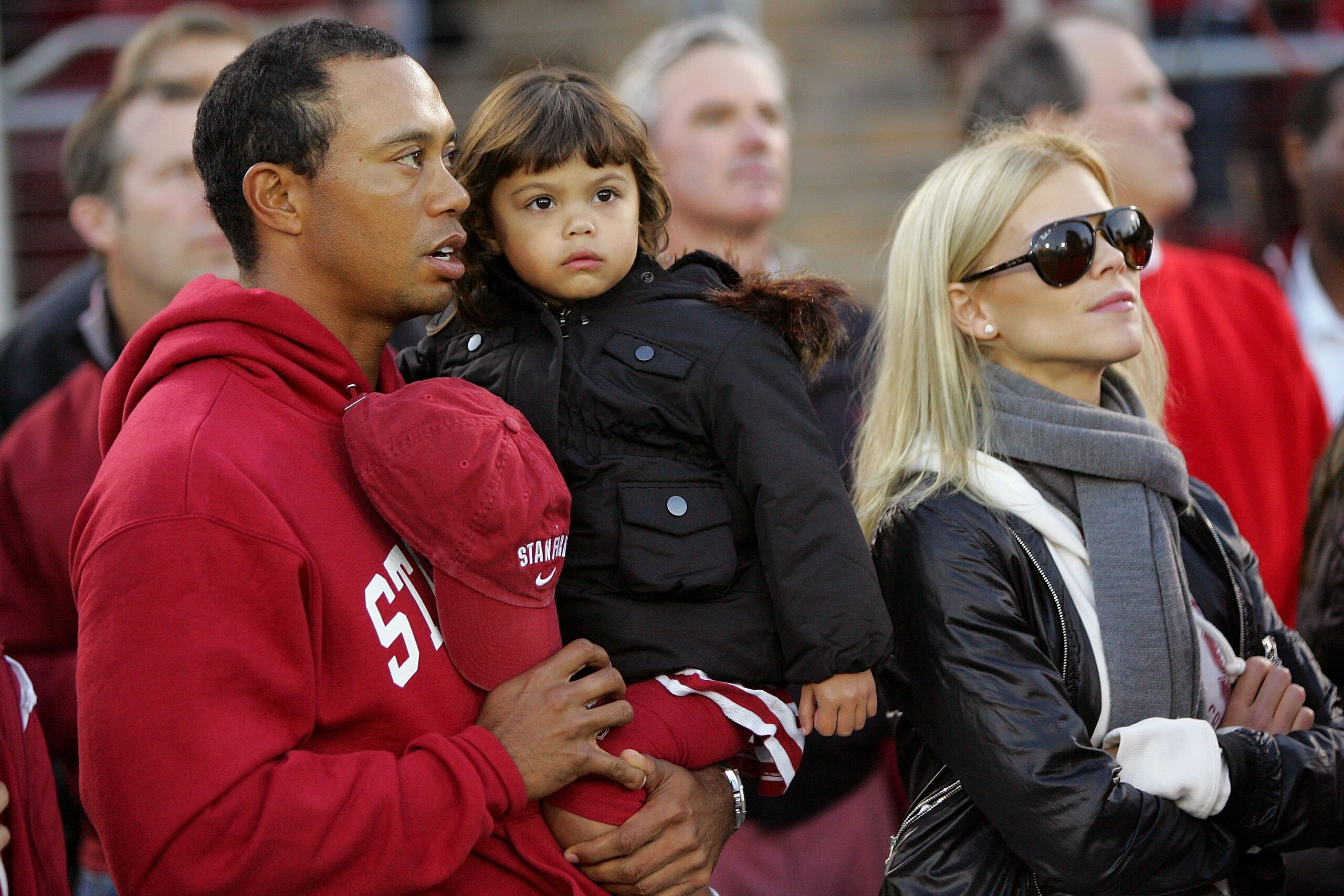 PALO ALTO, CA - NOVEMBER 21:  Honorary Standford Cardinal captain Tiger Woods his daugher, Sam, and wife, Elin Nordegren, stand on the sidelines before the Cardinal game against the California Bears at Stanford Stadium on November 21, 2009 in Palo Alto, C