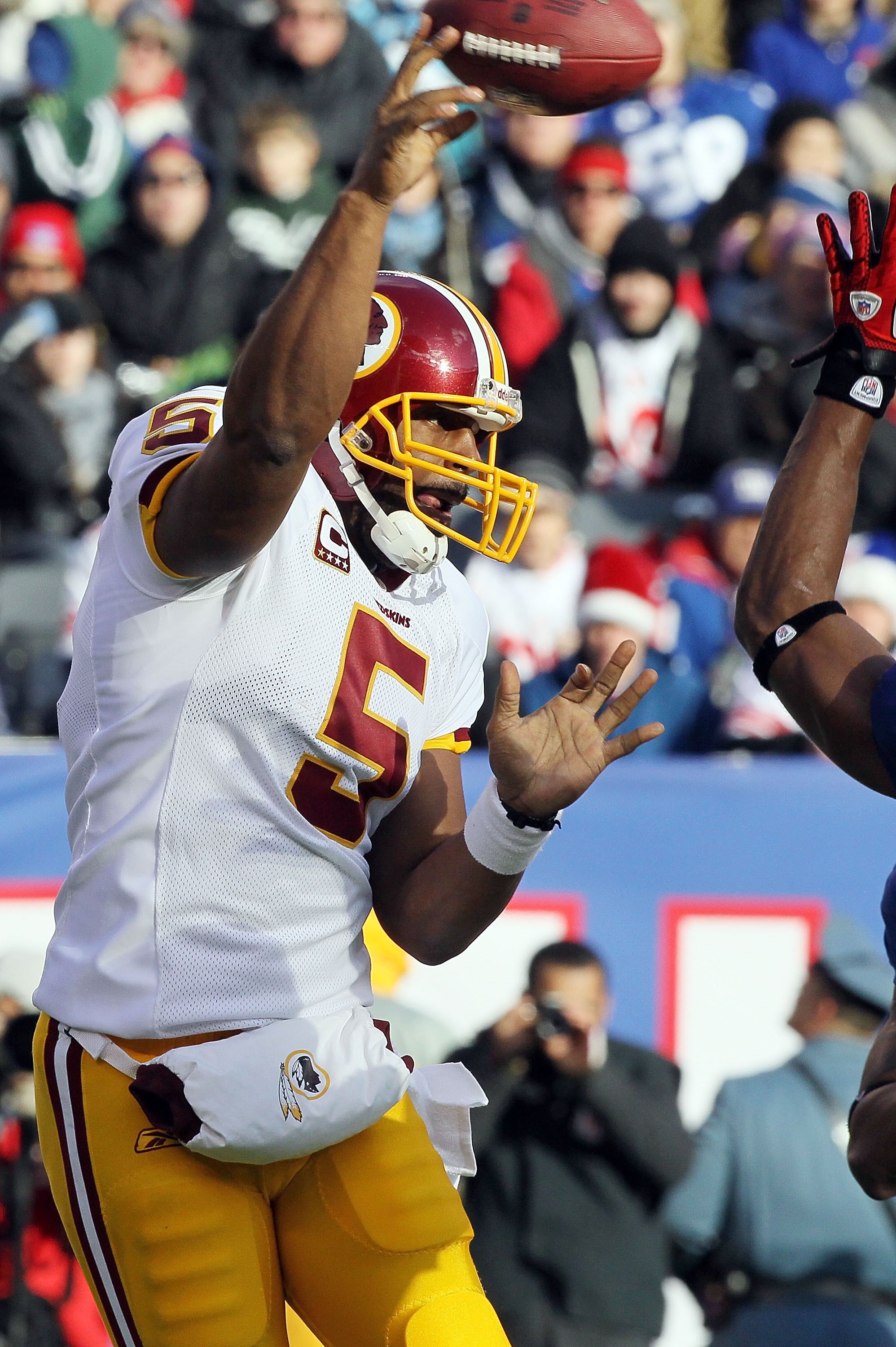 EAST RUTHERFORD, NJ - DECEMBER 05: Donovan McNabb #5 of the Washington Redskins throws a pass against the New York Giants on December 5, 2010 at the New Meadowlands Stadium in East Rutherford, New Jersey. The Giants defeated the Redskins 31-7. (Photo by EAST RUTHERFORD, NJ - DECEMBER 05: Donovan McNabb #5 of the Washington Redskins throws a pass against the New York Giants on December 5, 2010 at the New Meadowlands Stadium in East Rutherford, New Jersey. The Giants defeated the Redskins 31-7. (Photo by