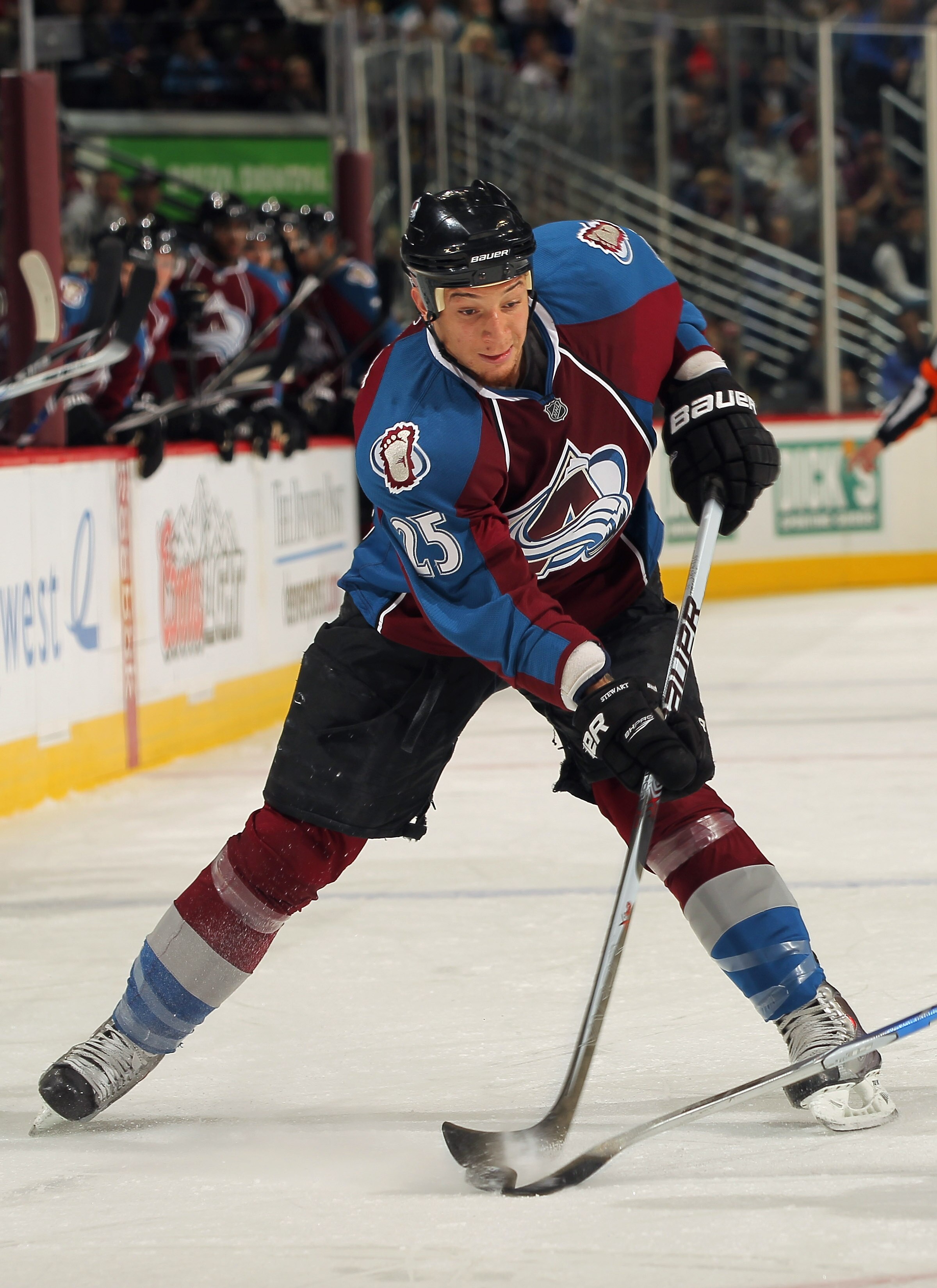 DENVER - NOVEMBER 17:  Chris Stewart #25 of the Colorado Avalanche takes a shot against the San Jose Sharks at the Pepsi Center on November 17, 2010 in Denver, Colorado. The Avalanche defeated the Sharks 4-3 in overtime.  (Photo by Doug Pensinger/Getty Im