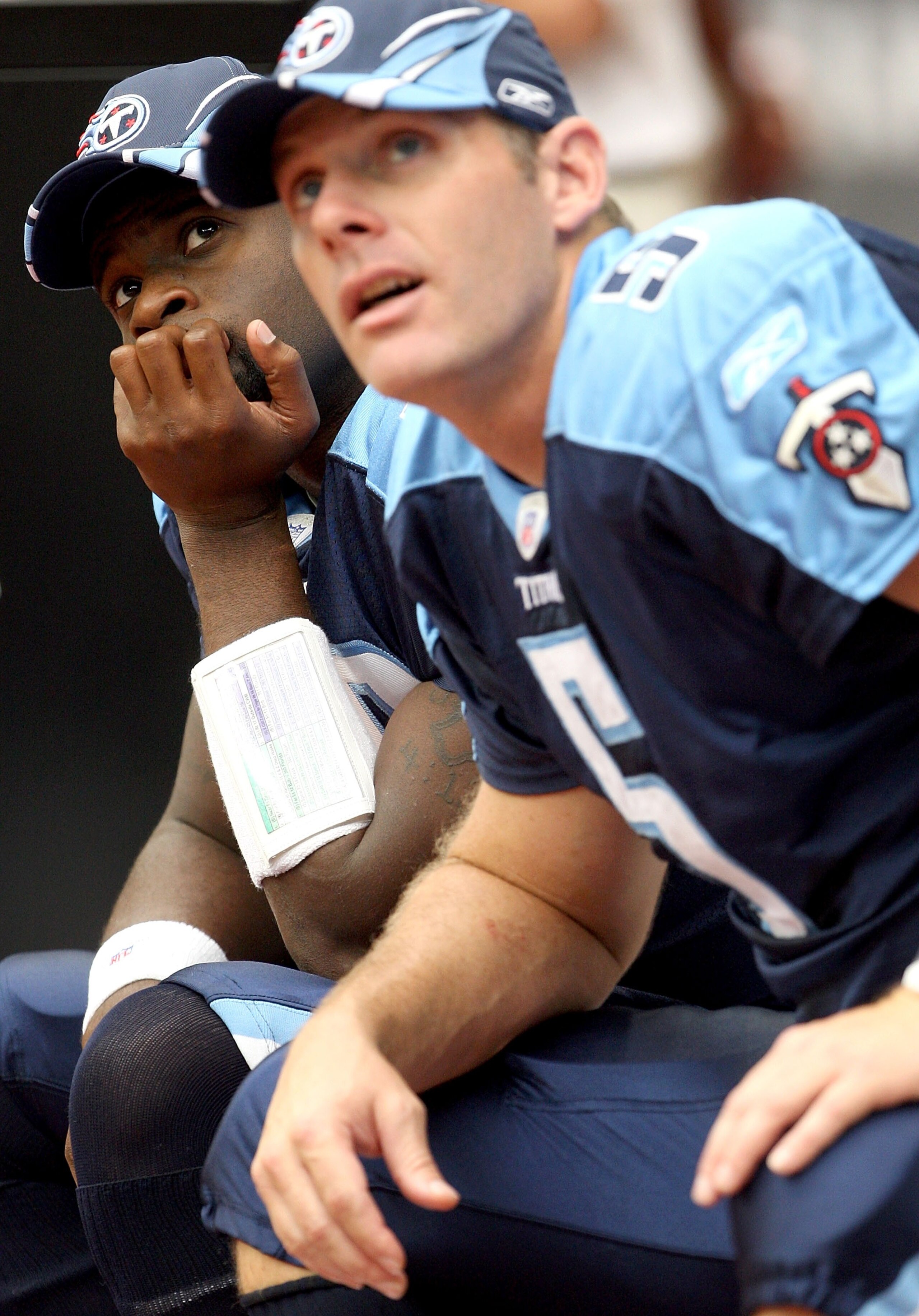 HOUSTON - OCTOBER 21: Quarterback Vince Young #10 of the Tennessee Titans sits on the bench next to Kerry Collins #5 as they both watch action on the jumbotron during the 1st half of the game against the Houston Texans on October 21, 2007 at Reliant Stad HOUSTON - OCTOBER 21: Quarterback Vince Young #10 of the Tennessee Titans sits on the bench next to Kerry Collins #5 as they both watch action on the jumbotron during the 1st half of the game against the Houston Texans on October 21, 2007 at Reliant Stad