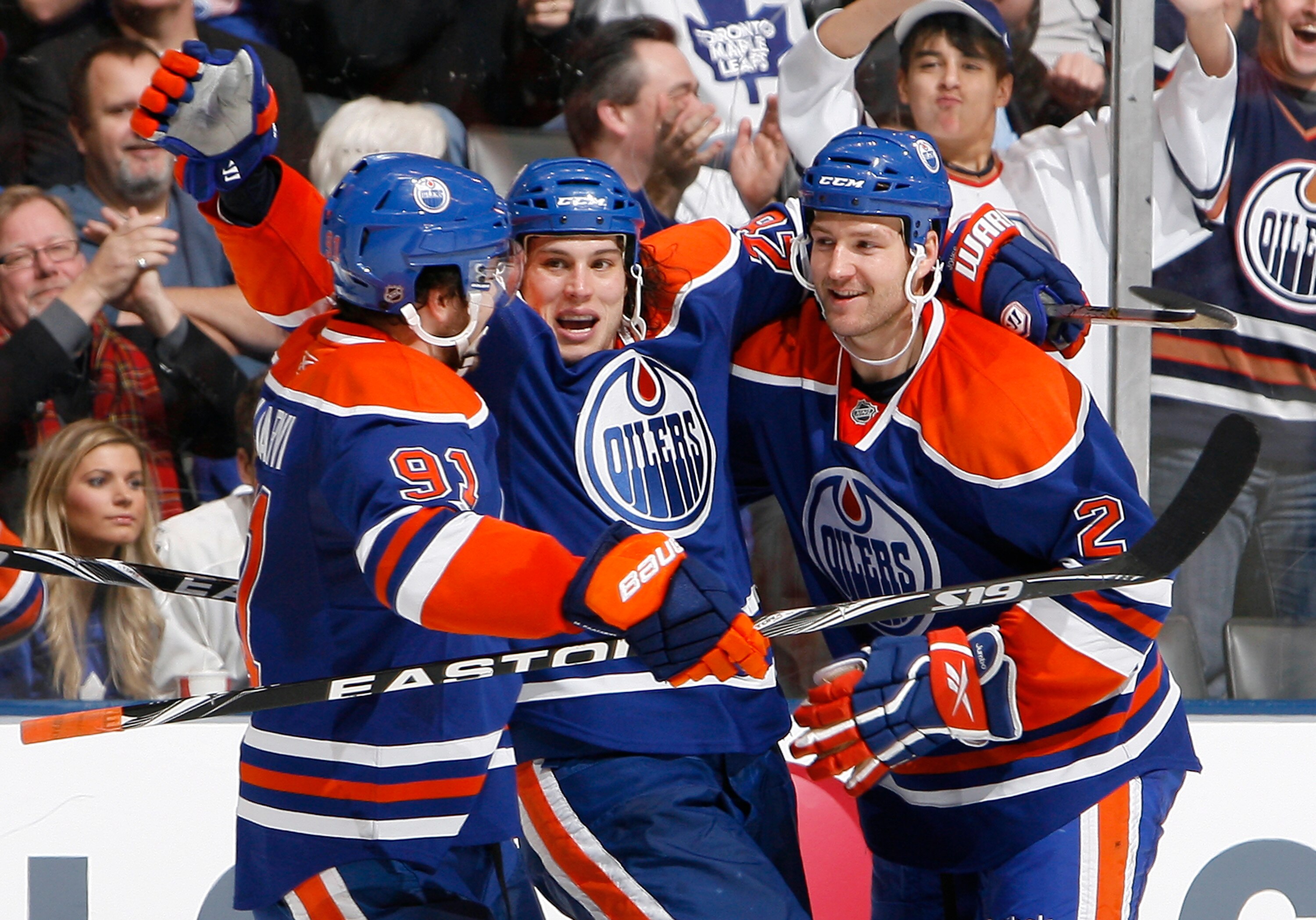TORONTO, CANADA - DECEMBER 2: Magnus Paajarvi #91, Ryan Jones #28 and Jim Vandermeer #2 of the Edmonton Oilers celebrate Ryan Jones goal against the Toronto Maple Leafs during game action at the Air Canada Centre December 2, 2010 in Toronto, Ontario, Cana