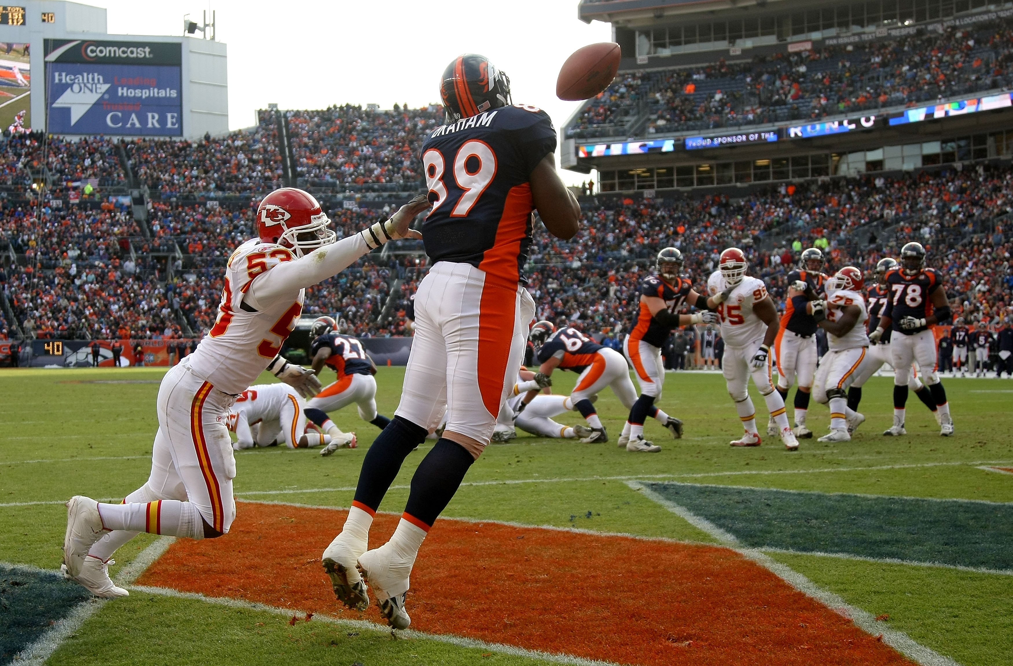 DENVER - JANUARY 03:  Daniel Graham #89 of the Denver Broncos is unable to make a pass reception in the endzone as Demorrio Williams #53 of the Kansas City Chiefs defends during NFL action at Invesco Field at Mile High on January 3, 2010 in Denver, Colora