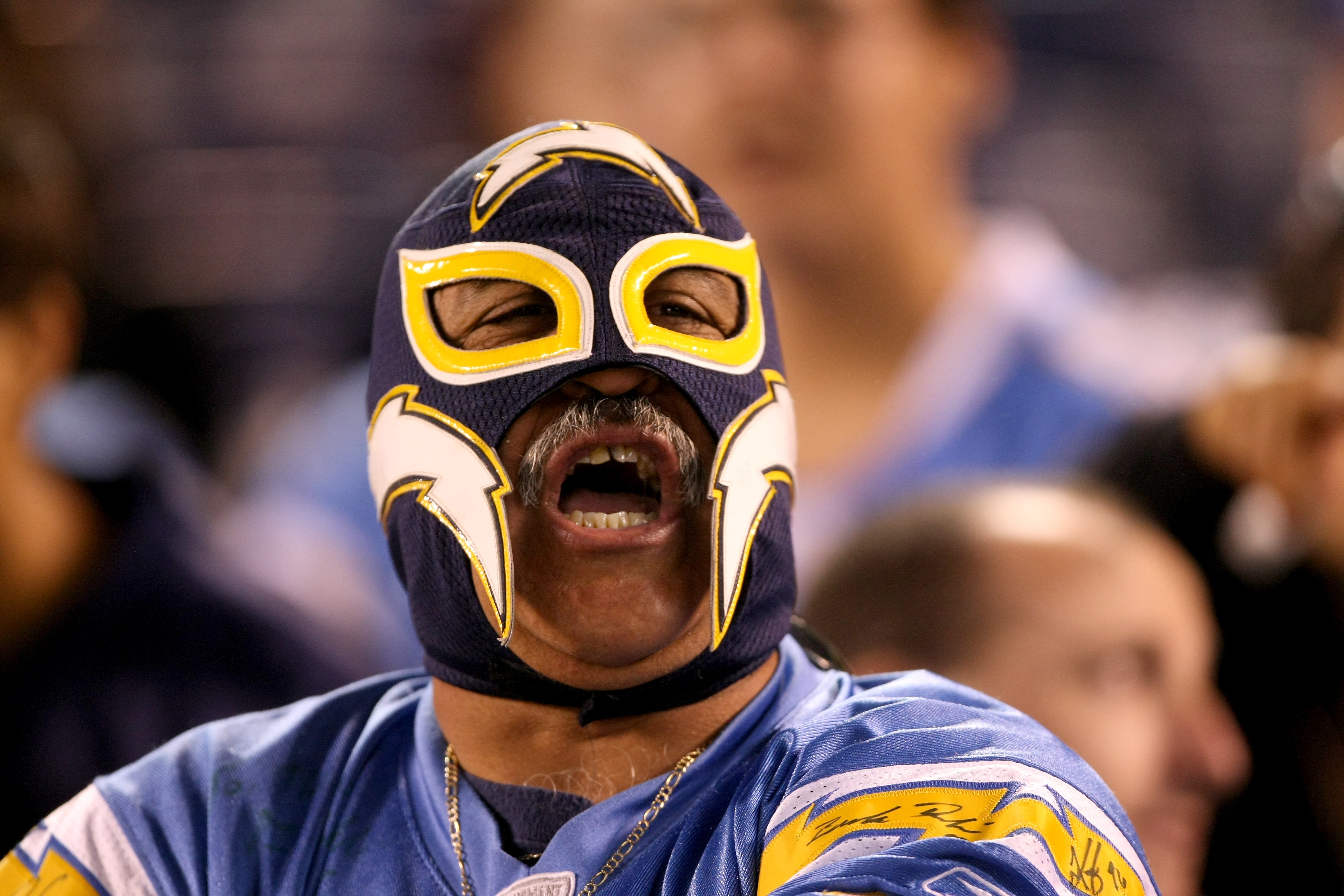 SAN DIEGO - AUGUST 15:  A fan cheers for the San Diego Chargers in the game with  the Seattle Seahawks on August 15, 2009 at Qualcomm Stadium in San Diego, California.   The Seahawks won 20-17.  (Photo by Stephen Dunn/Getty Images)