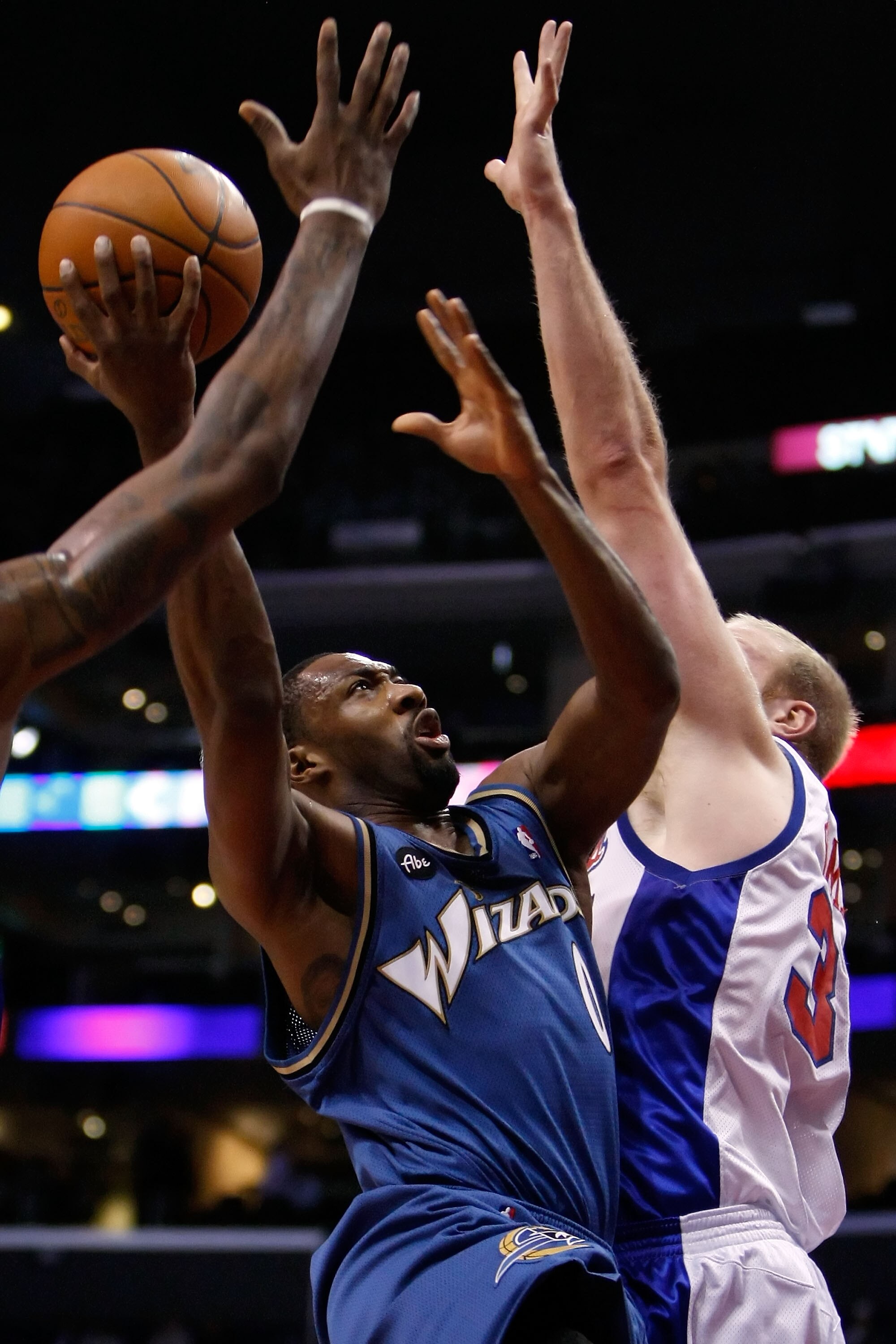 LOS ANGELES, CA - DECEMBER 14:  Gilbert Arenas #0 of the Washington Wizards drives to the basket past Chris Kaman #35 of the Los Angeles Clippers in the first half at Staples Center on December 14, 2009 in Los Angeles, California. NOTE TO USER: User expre