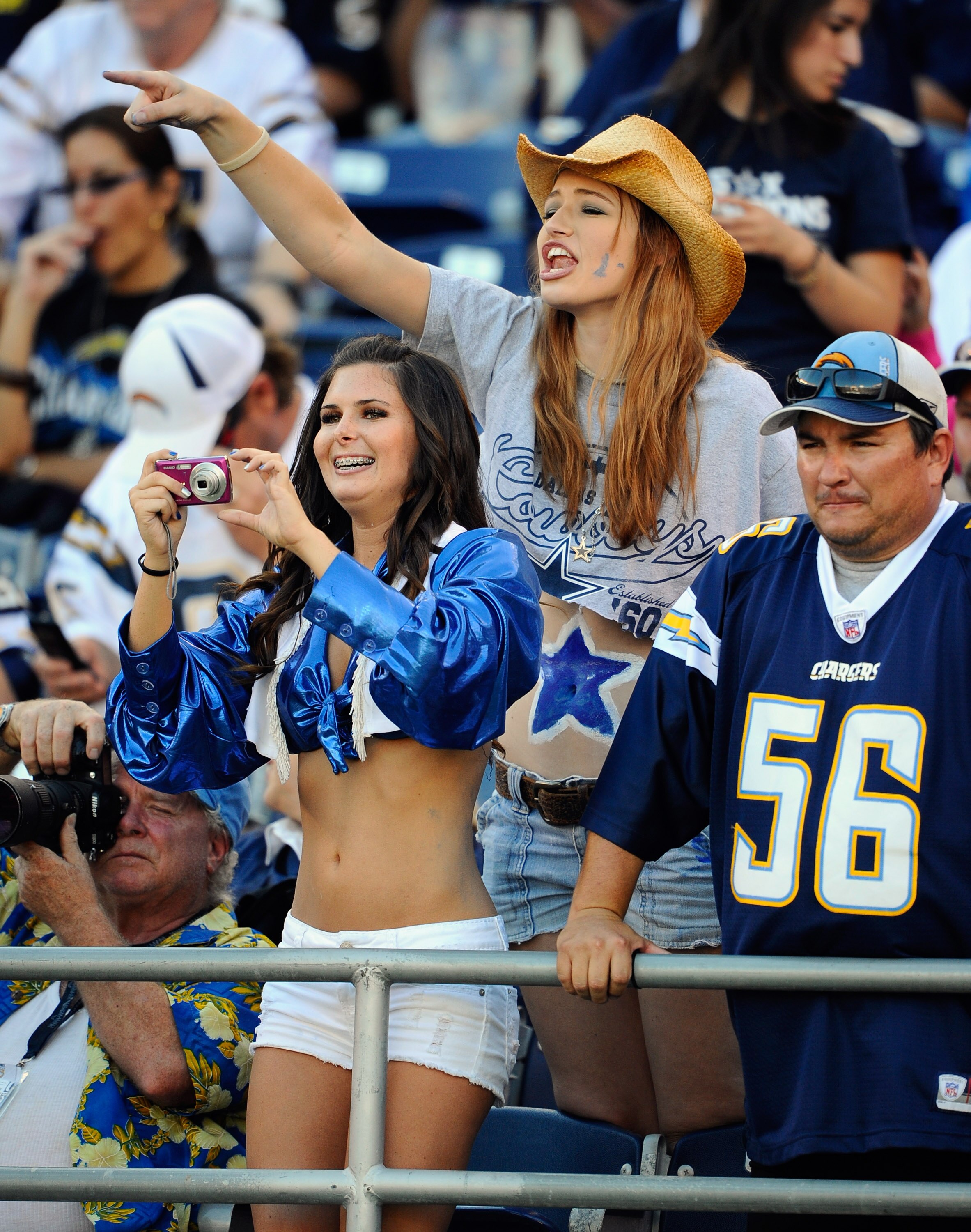 SAN DIEGO - AUGUST 21:  Fans of Dallas Cowboys cheer during the pre-season NFL football game against San Diego Chargers at Qualcomm Stadium on August 21, 2010 in San Diego, California.  (Photo by Kevork Djansezian/Getty Images)