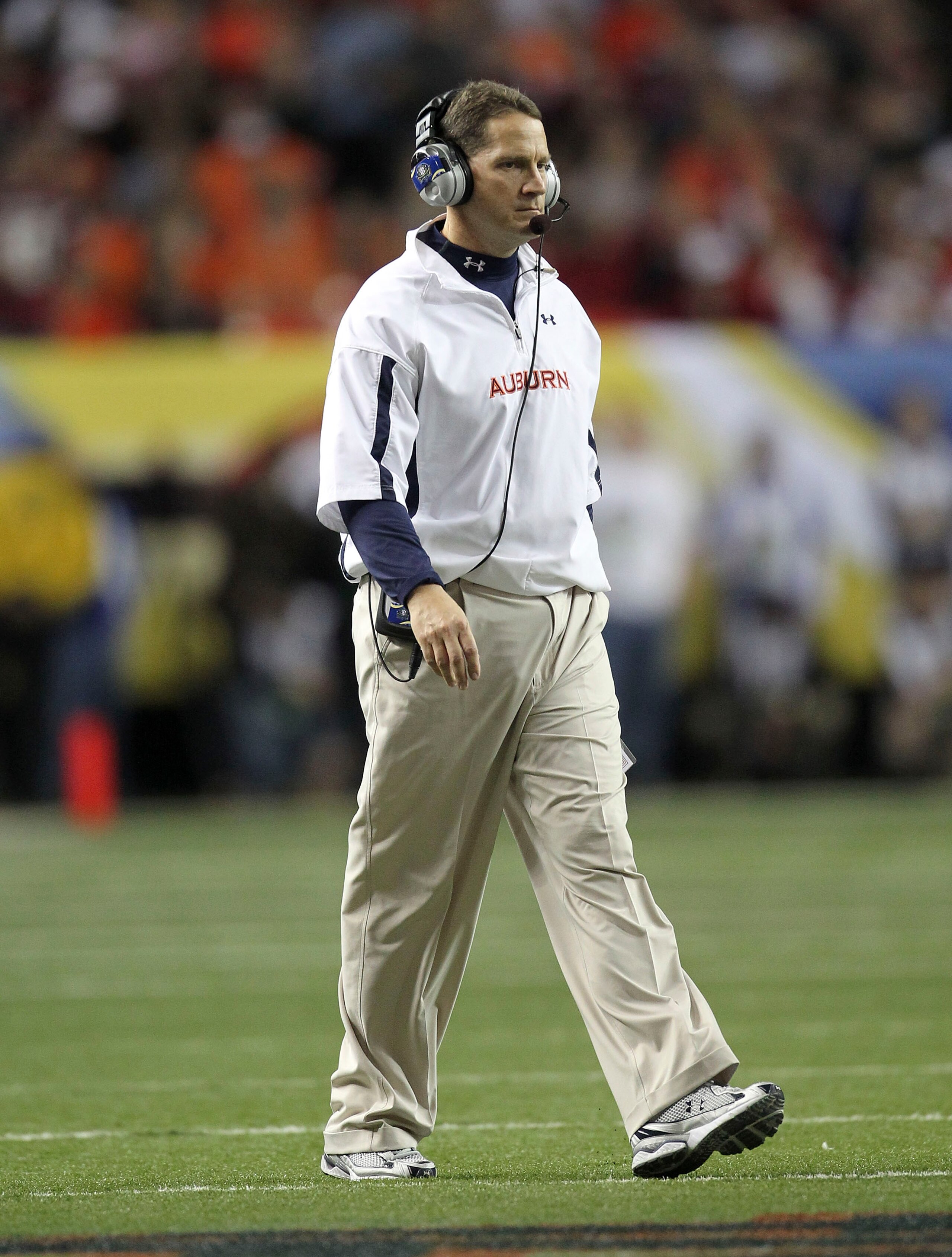 ATLANTA - DECEMBER 4: Head coach Gene Chizik of the Auburn Tigers walks on the field during a timeout during the 2010 SEC Championship against the South Carolina Gamecocks at Georgia Dome on December 4, 2010 in Atlanta, Georgia. (Photo by Mike Zarrilli/G ATLANTA - DECEMBER 4: Head coach Gene Chizik of the Auburn Tigers walks on the field during a timeout during the 2010 SEC Championship against the South Carolina Gamecocks at Georgia Dome on December 4, 2010 in Atlanta, Georgia. (Photo by Mike Zarrilli/G