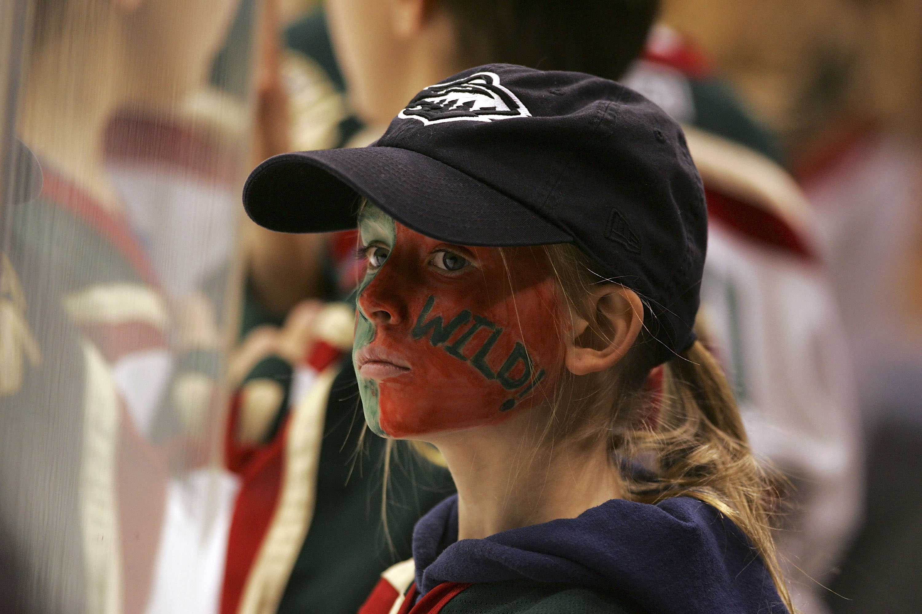 SAINT PAUL, MN - JANUARY 9: A young fan of the Minnesota Wild watches warm-ups prior to the Wild game against the Dallas Stars at the Xcel Energy Center on January 9, 2006 in Saint Paul, Minnesota. (Photo by Bruce Bennett/Getty Images)