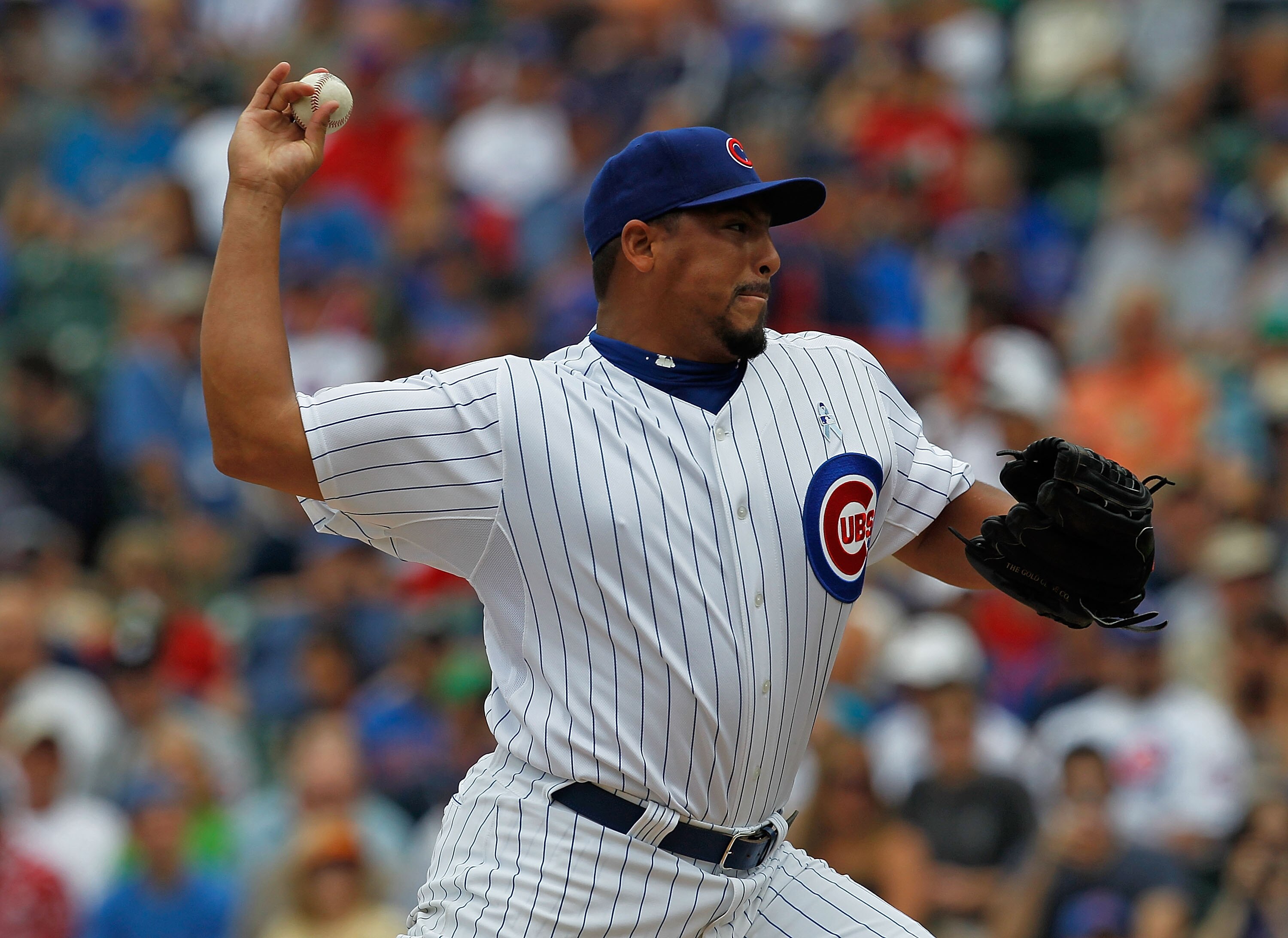 CHICAGO - JUNE 20: Starting pitcher Carlos Zambrano #38 of the Chicago Cubs delivers the ball against the Los Angeles Angels of Anaheim at Wrigley Field on June 20, 2010 in Chicago, Illinois. (Photo by Jonathan Daniel/Getty Images)