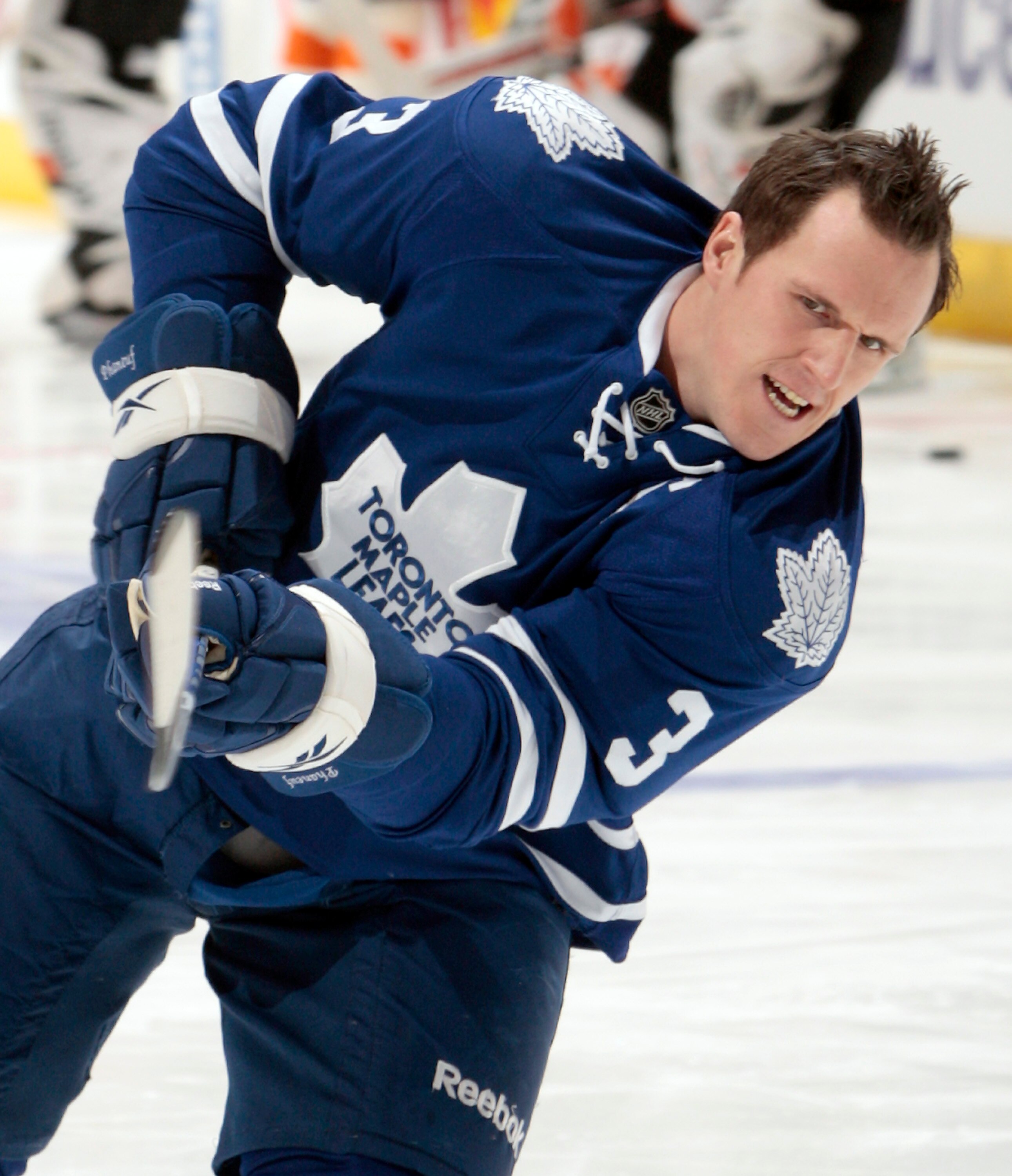 TORONTO, CANADA - DECEMBER 9: Dion Phaneuf #3 of the Toronto Maple Leafs shoots during warmup before facing the Philadelphia Flyers during game action at the Air Canada Centre December 9, 2010 in Toronto, Ontario, Canada. (Photo by Abelimages/Getty Images